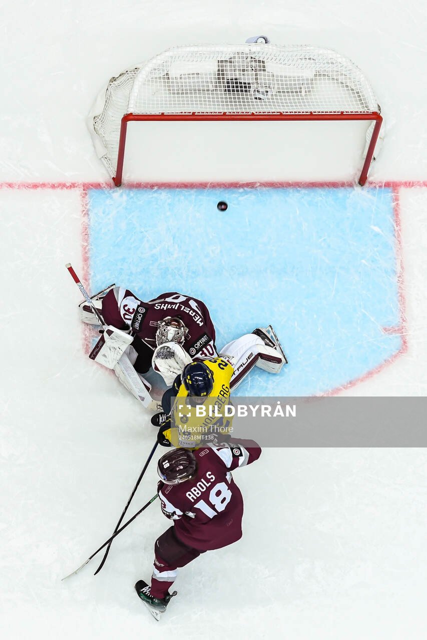 Pontus Holmberg of Sweden sees Joel Eriksson Ek of Sweden