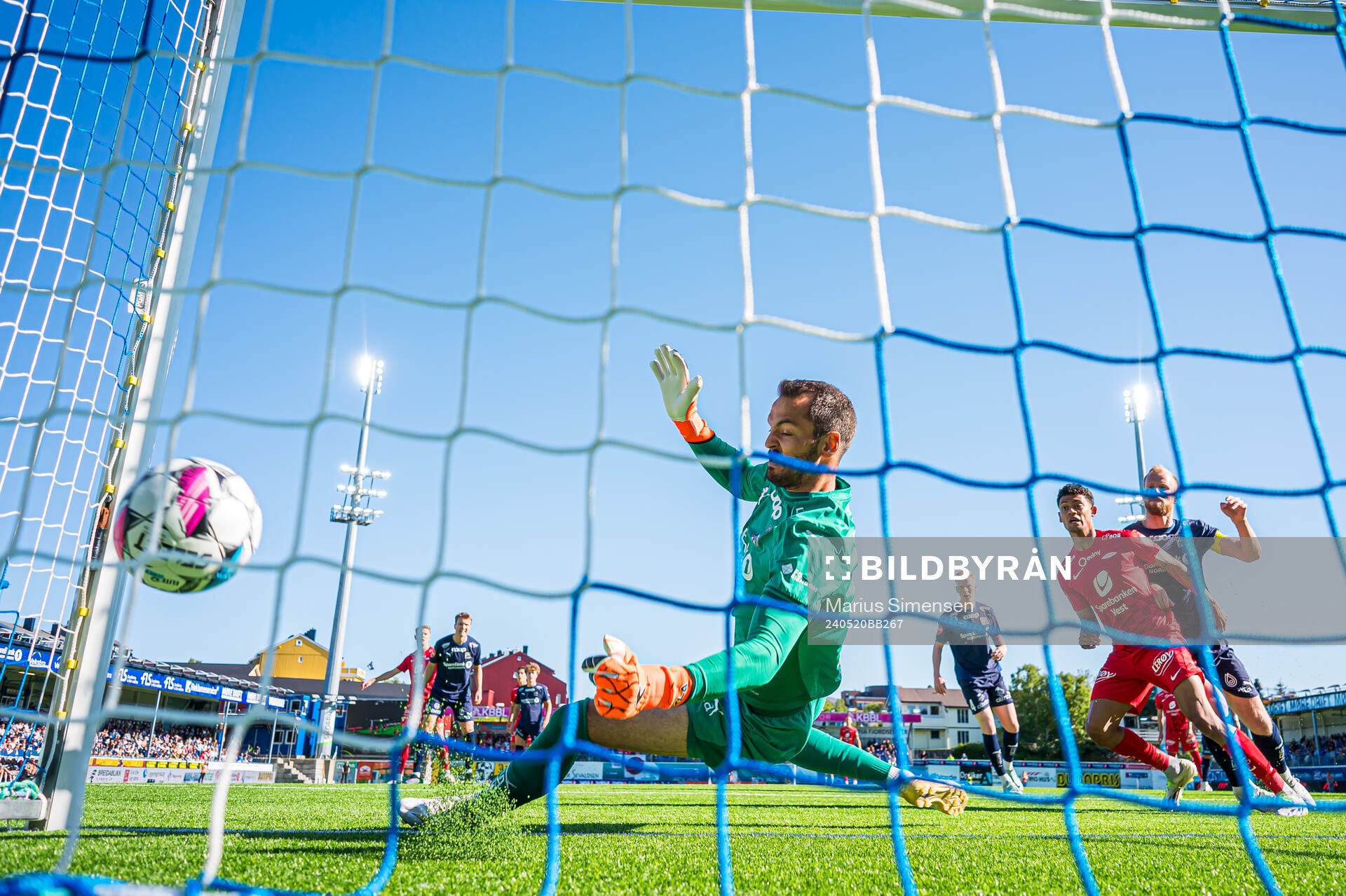 Bård Finne of Brann scores the 1-1 goal behind Michael
