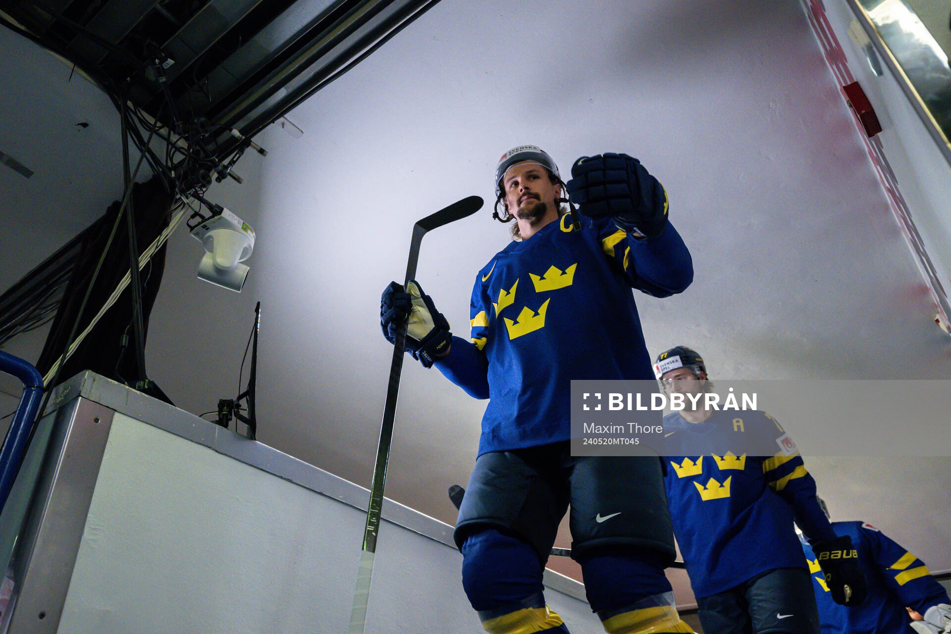Erik Karlsson and Victor Hedman of Sweden enter the ice