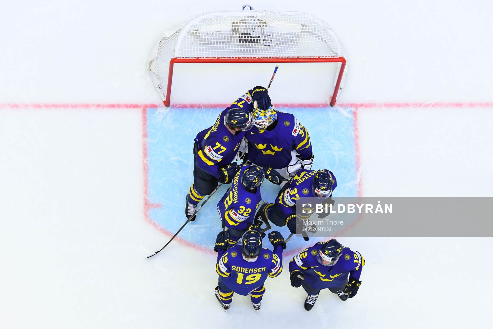 Goaltender Samuel Ersson celebrate with team mates