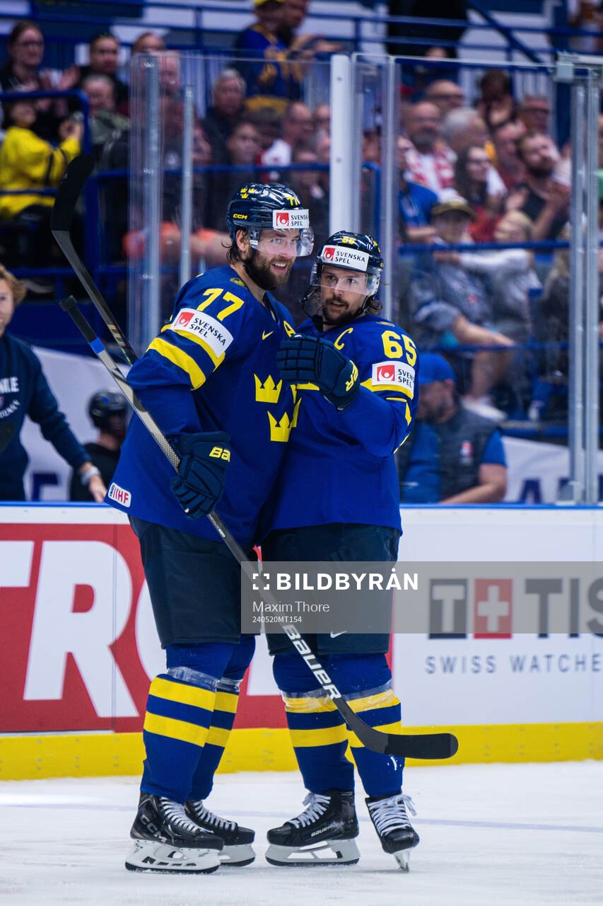 Victor Hedman and Erik Karlsson of Sweden celebrates the