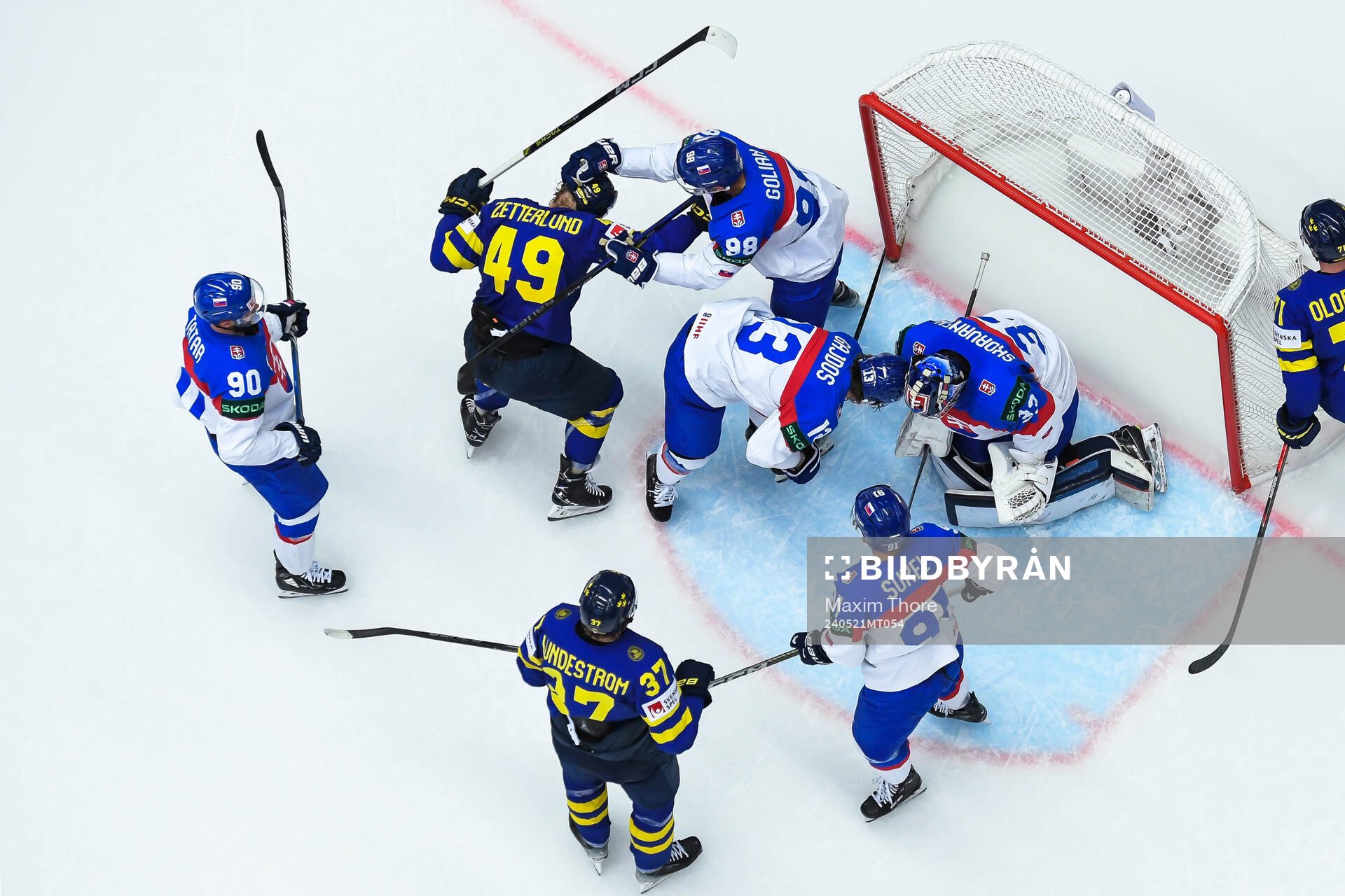 Fabian Zetterlund of Sweden fights with Andrej Golian of