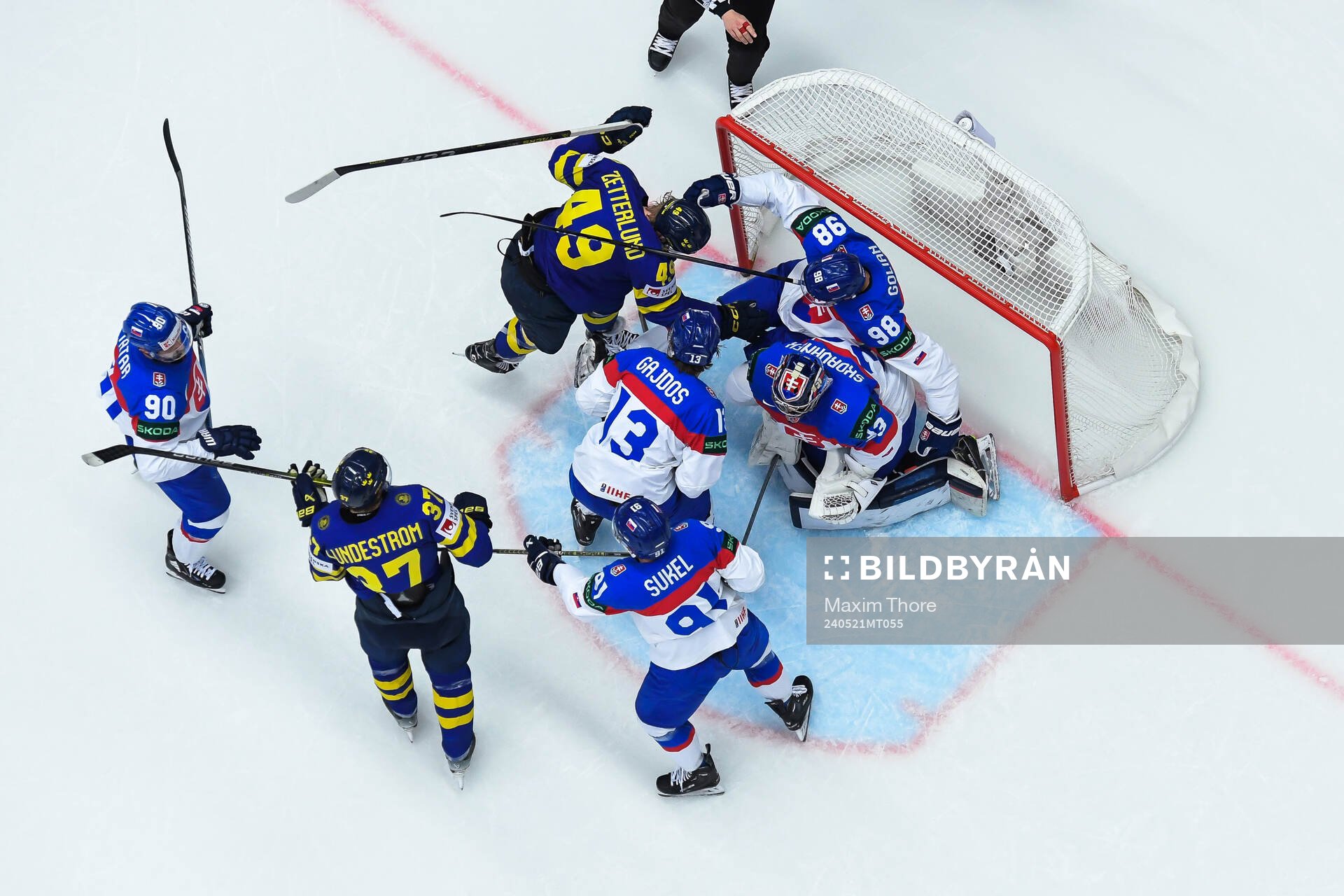 Fabian Zetterlund of Sweden fights with Andrej Golian of
