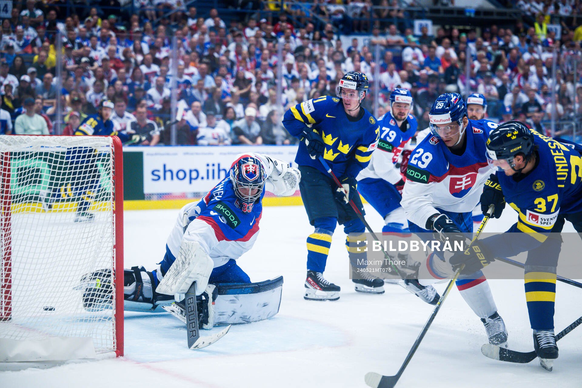 Isac Lundeström of Sweden scores 4-0 behind goaltender