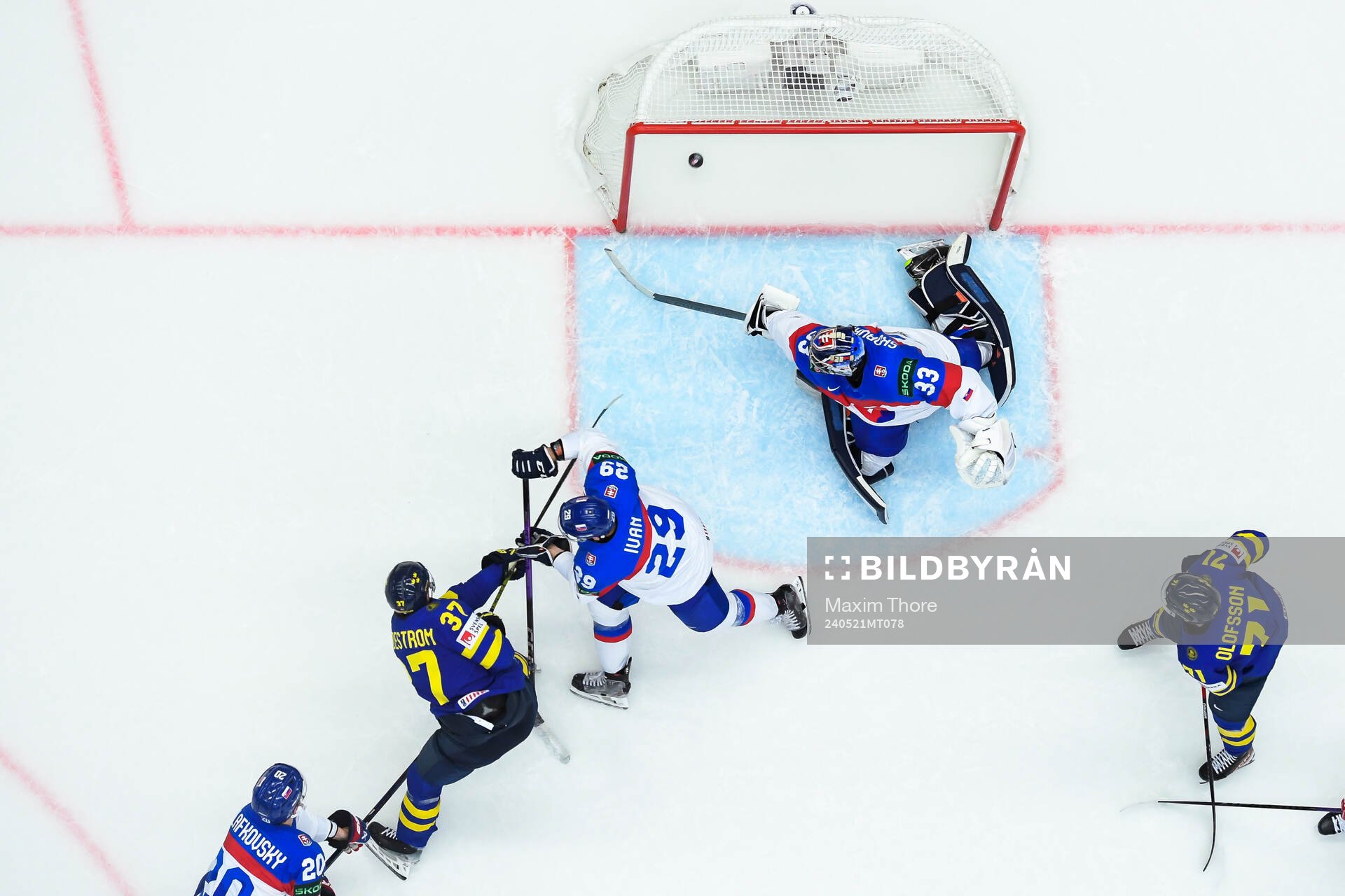 Isac Lundeström of Sweden scores 4-0 behind goaltender