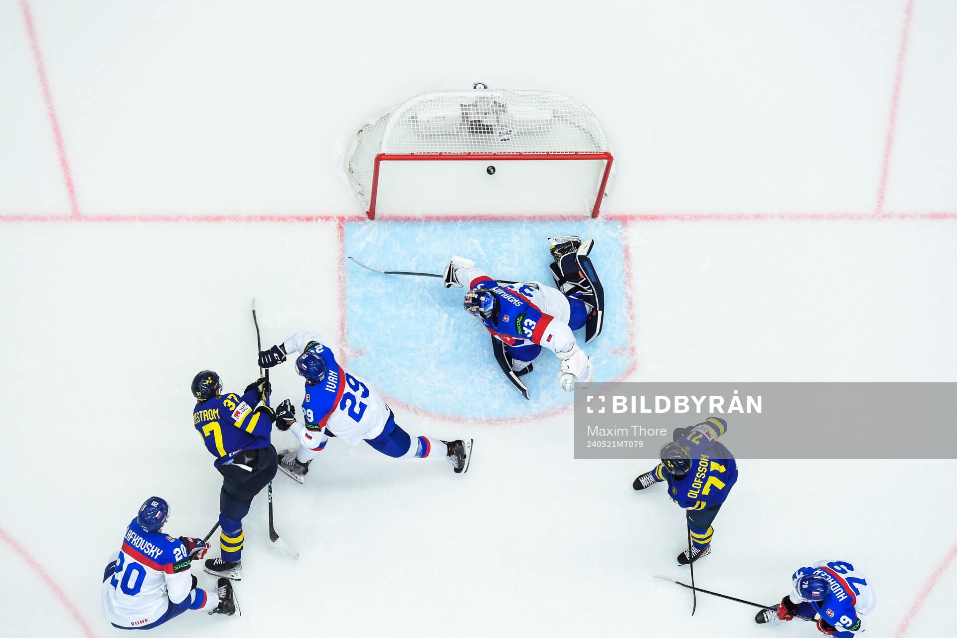 Isac Lundeström of Sweden scores 4-0 behind goaltender