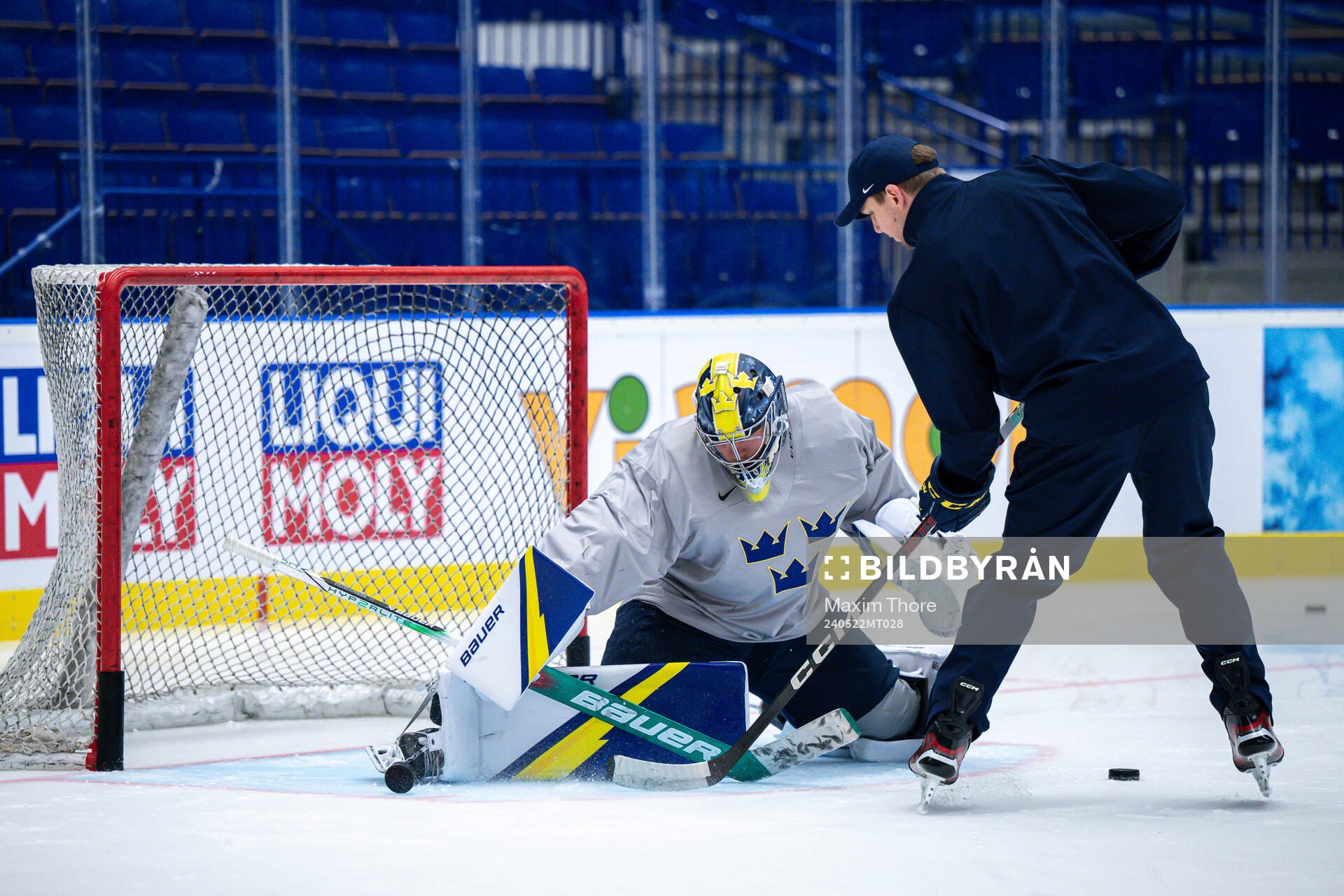 Goaltender Filip Gustavsson and goaltender coach Anthon