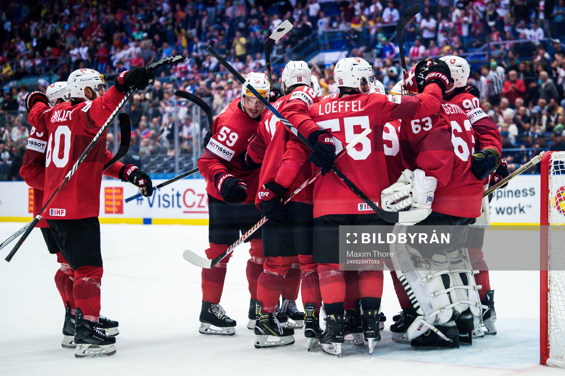 Goaltender Leonardo Genoni of Switzerland celebrates with