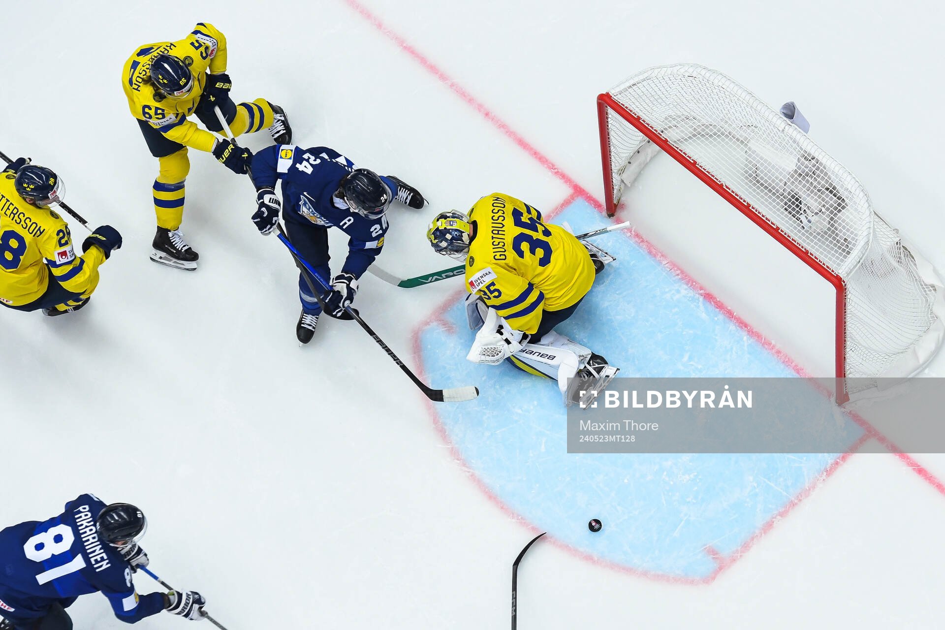 Hannes Björninen of Finland and goaltender Filip
