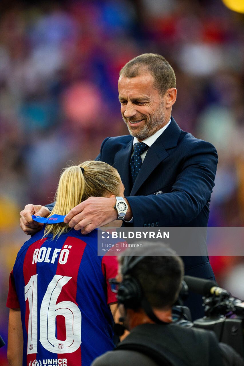 UEFA president Aleksander Ceferin hands Fridolina Rolfö of