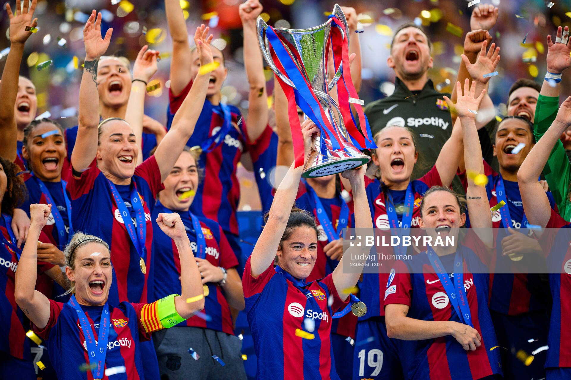 Marta Torrejon of Barcelona lifts the trophy