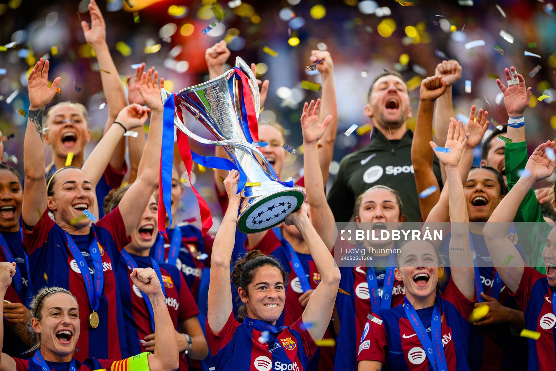 Marta Torrejon of Barcelona lifts the trophy
