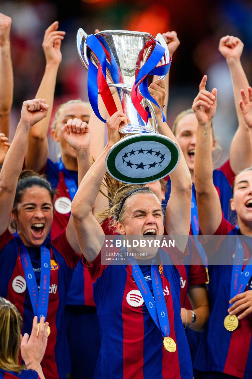 Irene Paredes of Barcelona lifts the trophy