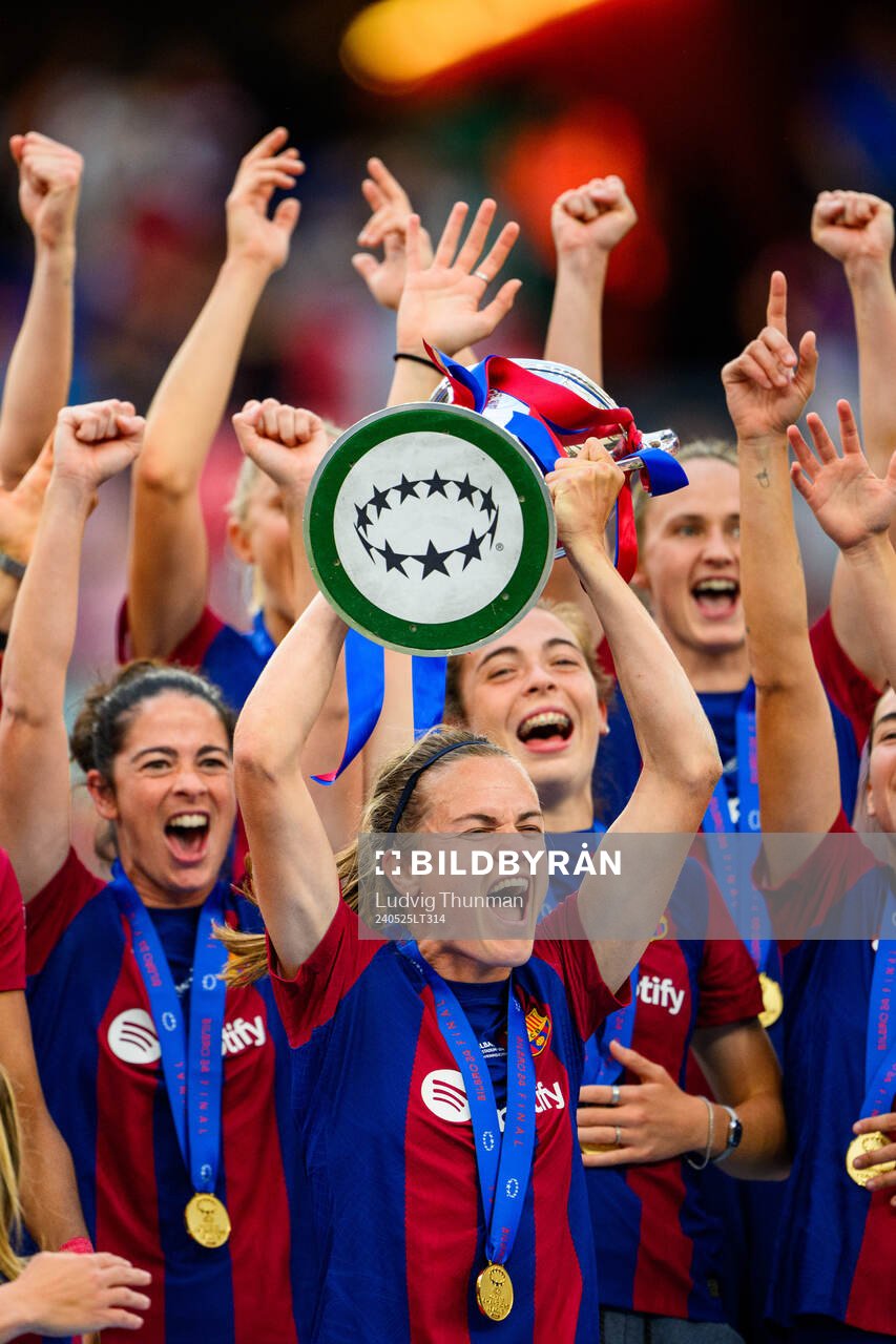 Irene Paredes of Barcelona lifts the trophy