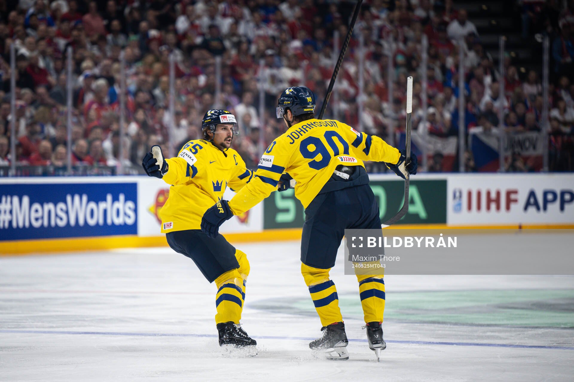 Erik Karlsson and Marcus Johansson of Sweden celebrate the