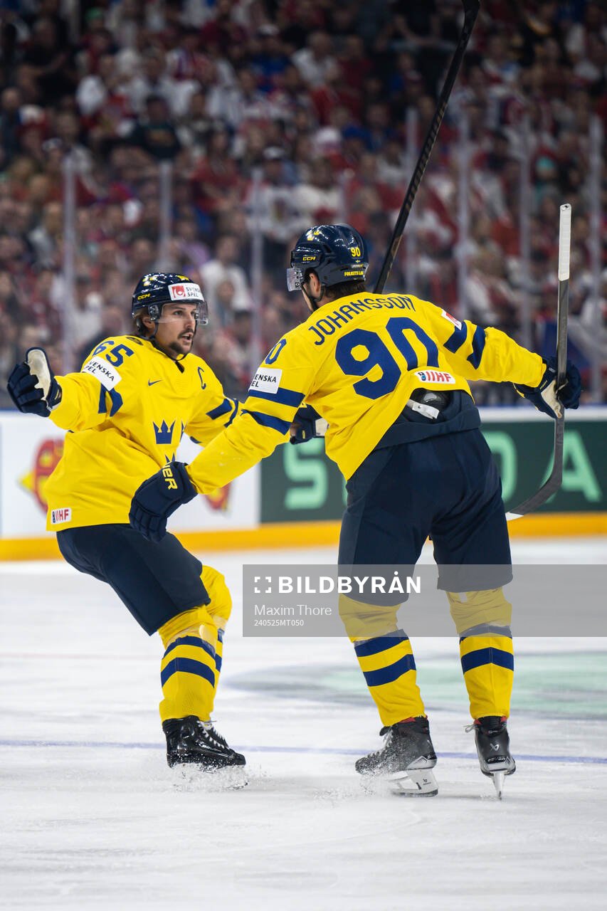 Erik Karlsson and Marcus Johansson of Sweden celebrate the