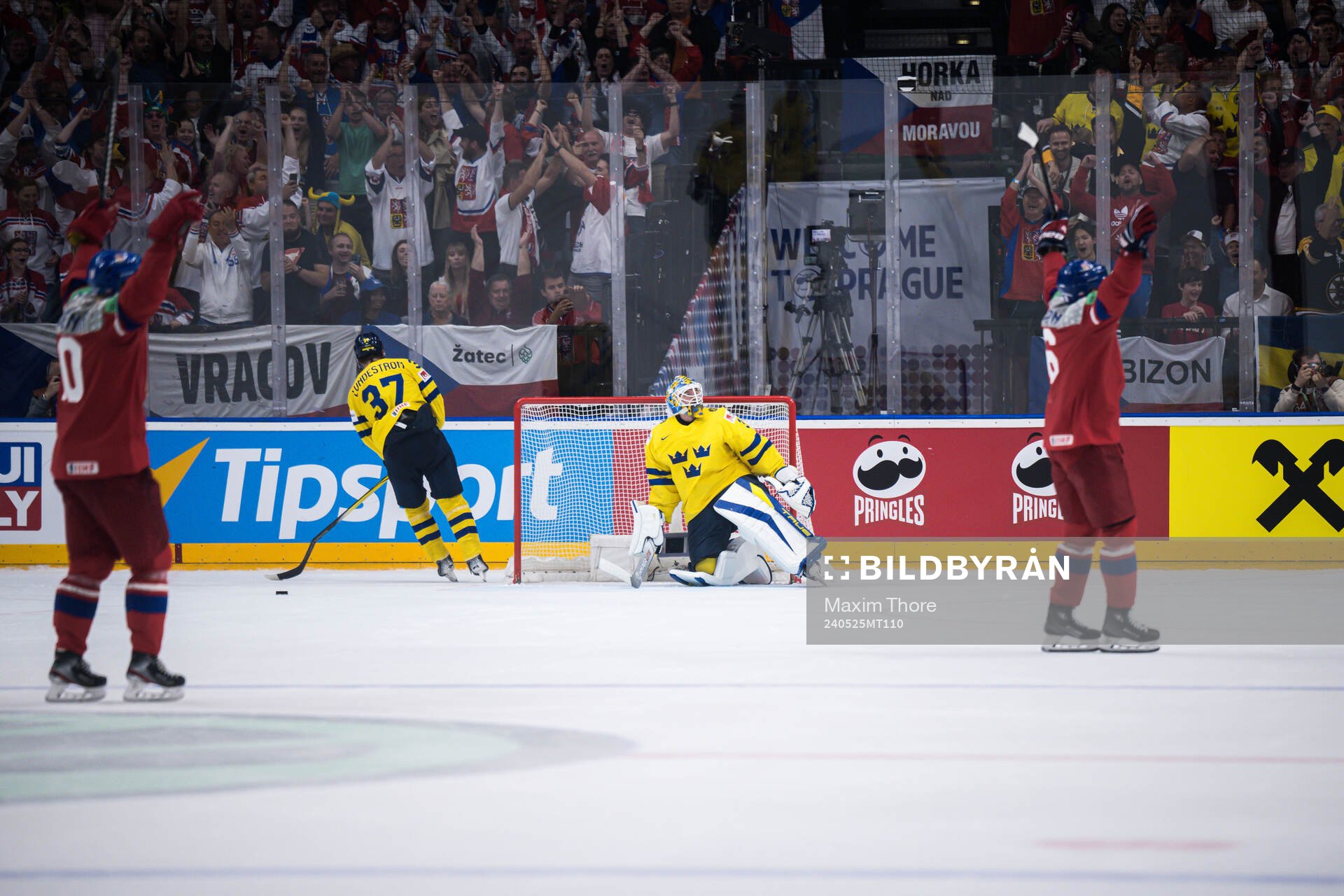 Goaltender Samuel Ersson of Sweden looks dejected