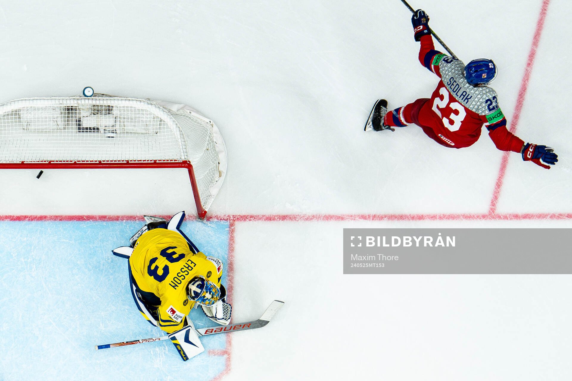 Goaltender Samuel Ersson Sweden looks dejected while Lukas