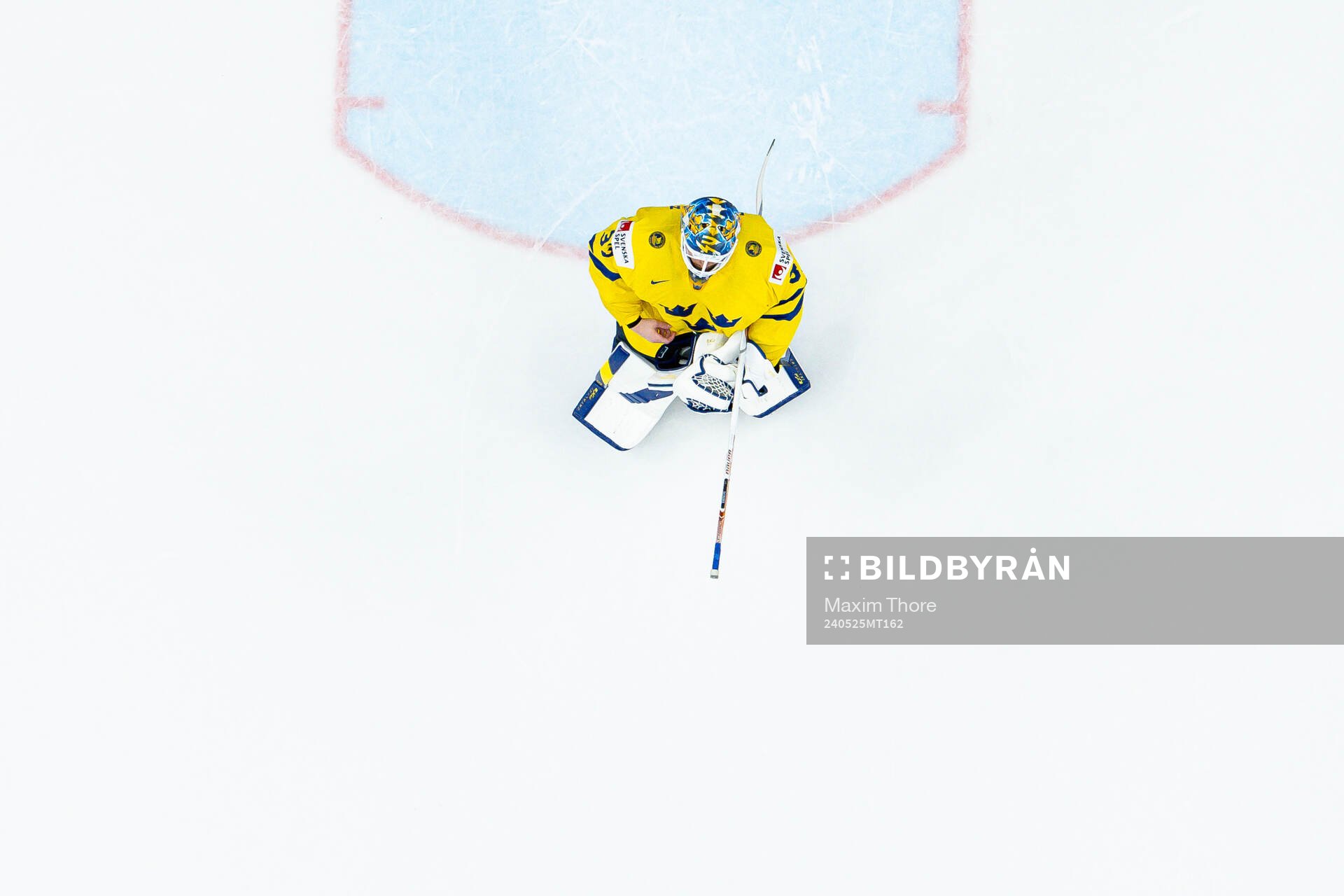 Goaltender Samuel Ersson of Sweden looks dejected