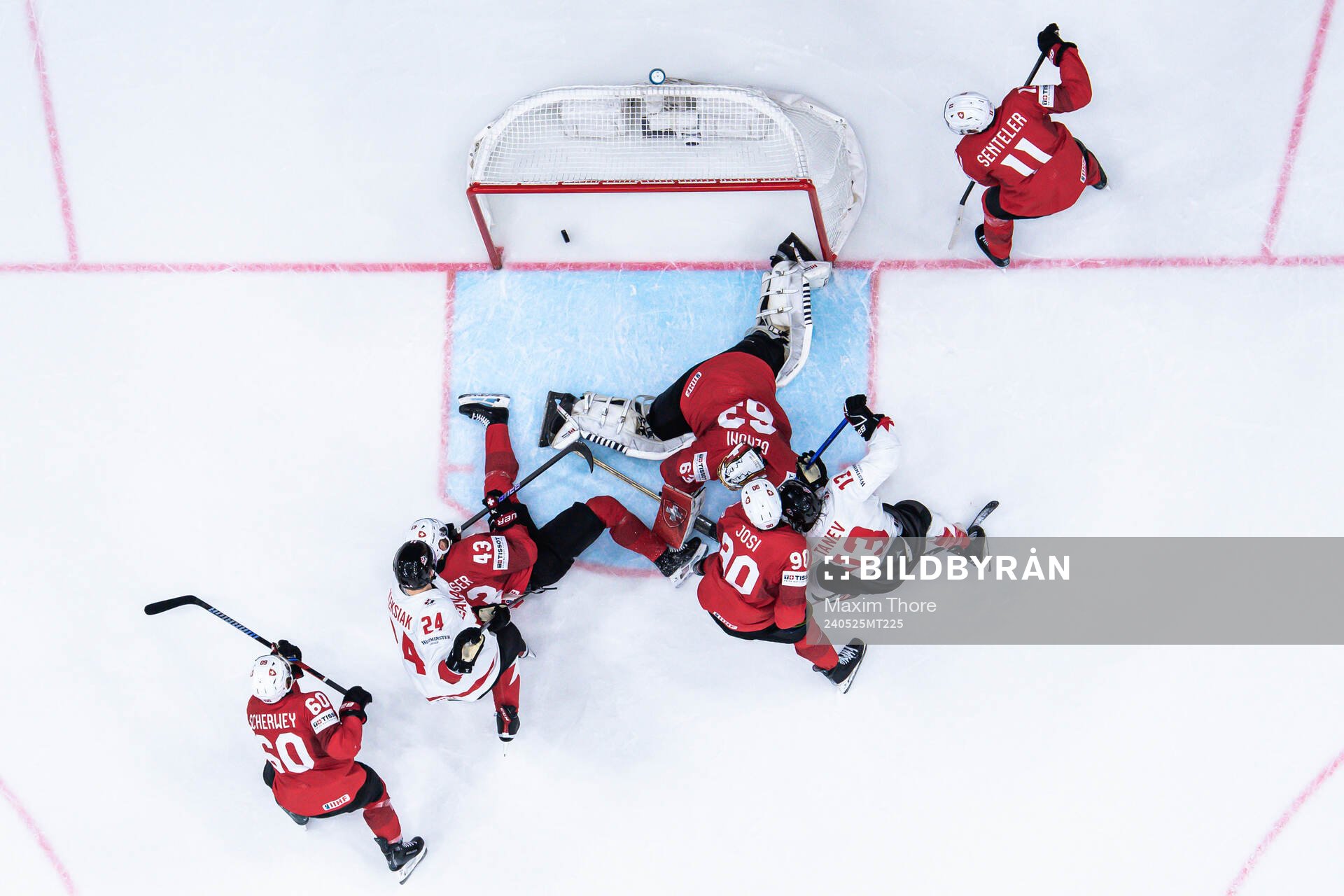 Brandon Tanev of Canada scores the 1-2 goal behind