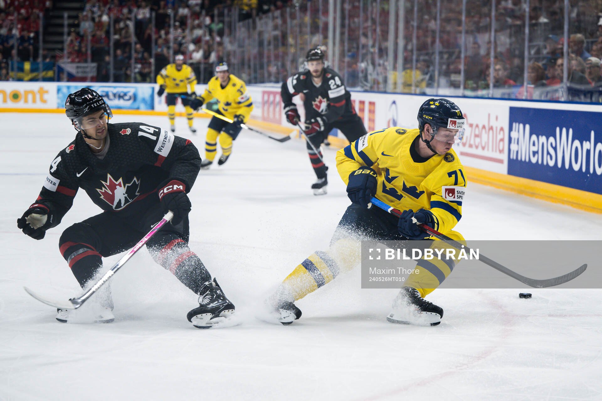Dylan Guenther of Canada and Victor Olofsson of Sweden
