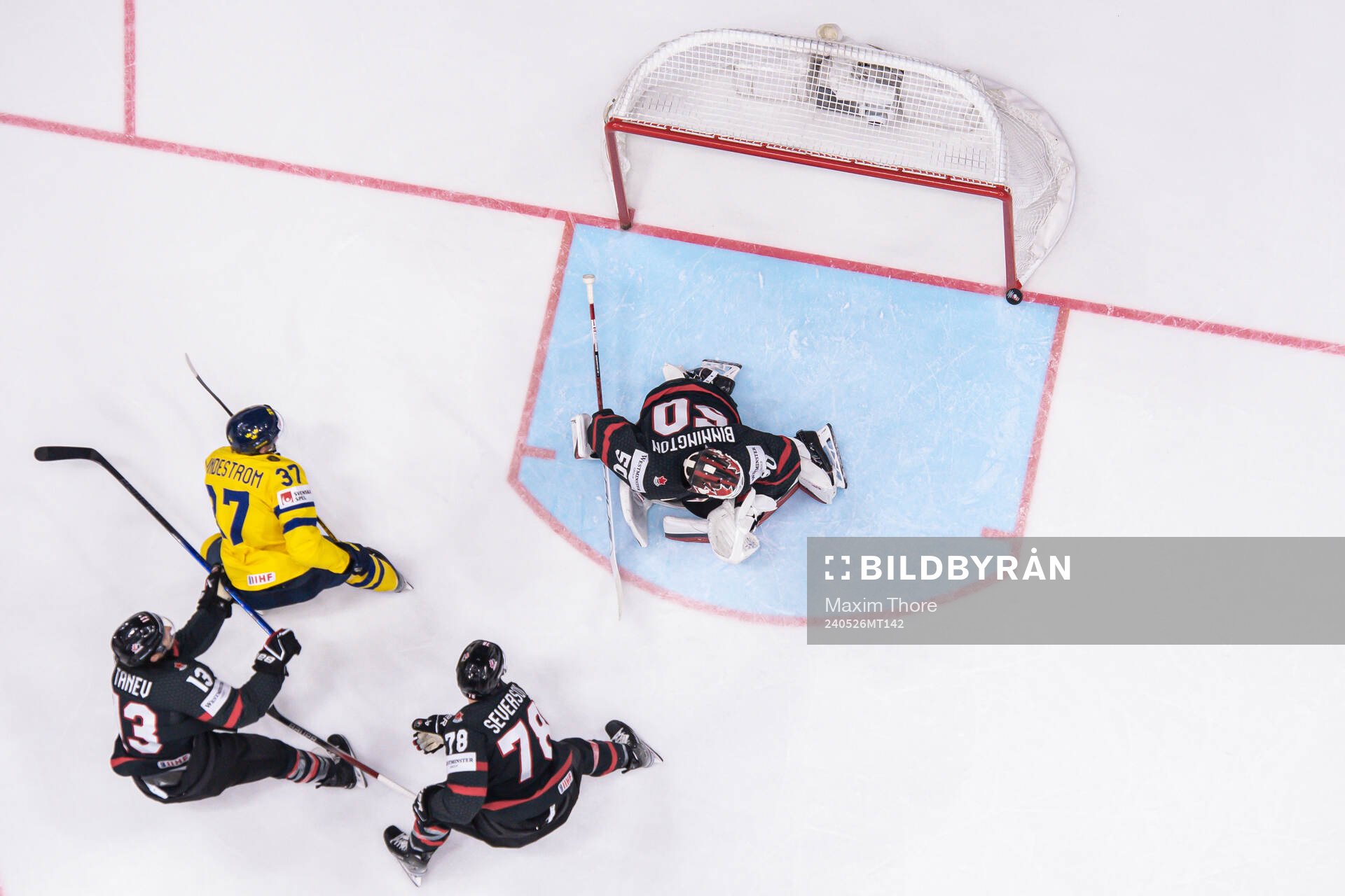 Isac Lundeström of Sweden against goaltender Jordan