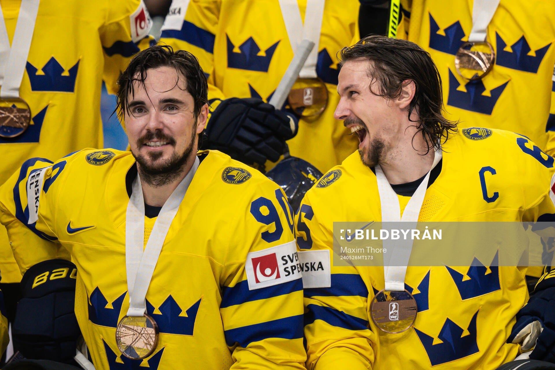 Marcus Johansson and Erik Karlsson of Sweden gather for a