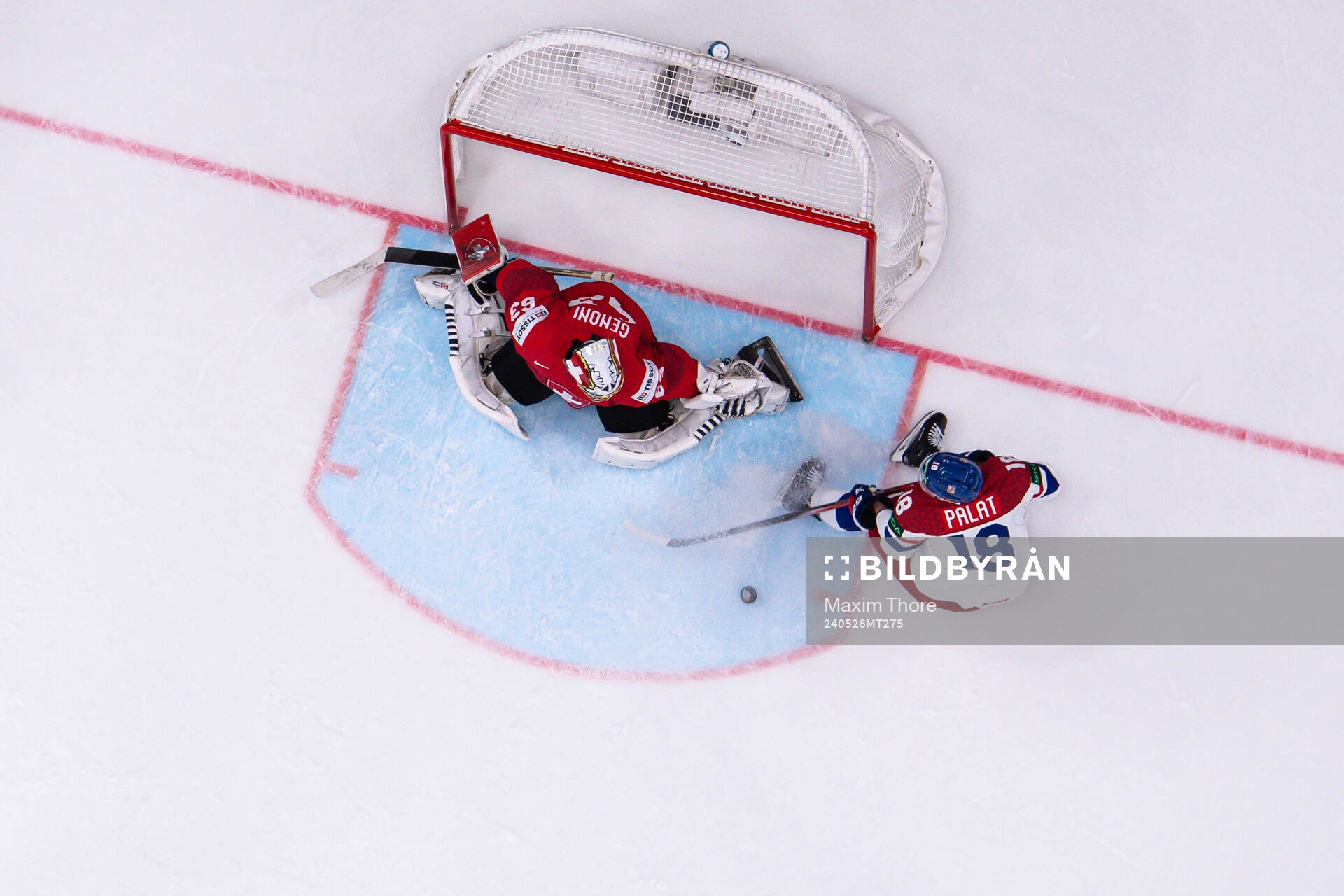 Goaltender Leonardo Genoni of Switzerland and Ondrej Palat