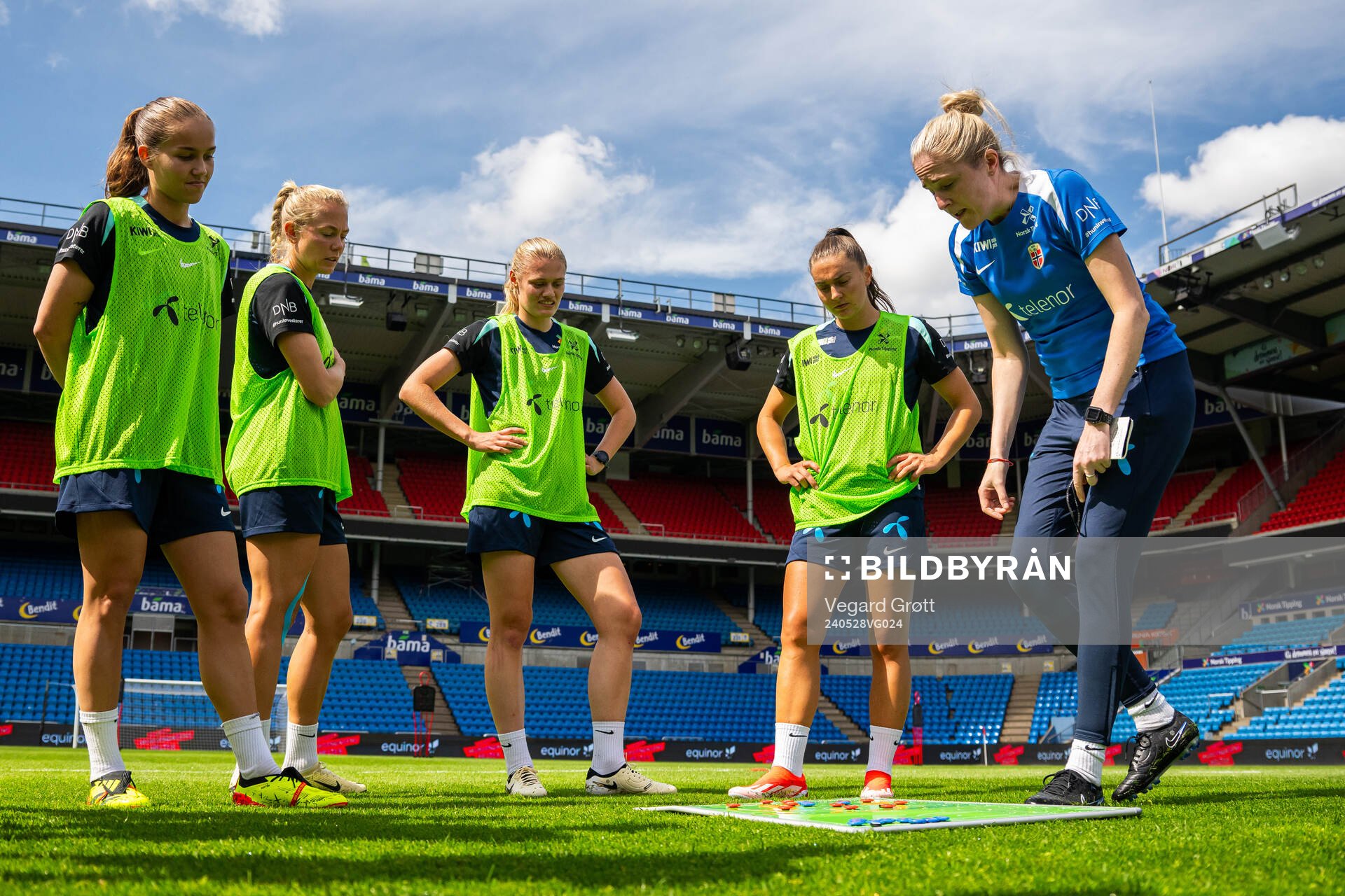Guro Reiten, Guro Bergsvand, Mathilde Harviken and Vilde Bøe Risa listen to Gemma Grainger, head coach of the Norwegian women's national football team, during a training session on May 28, 2024 in Oslo.