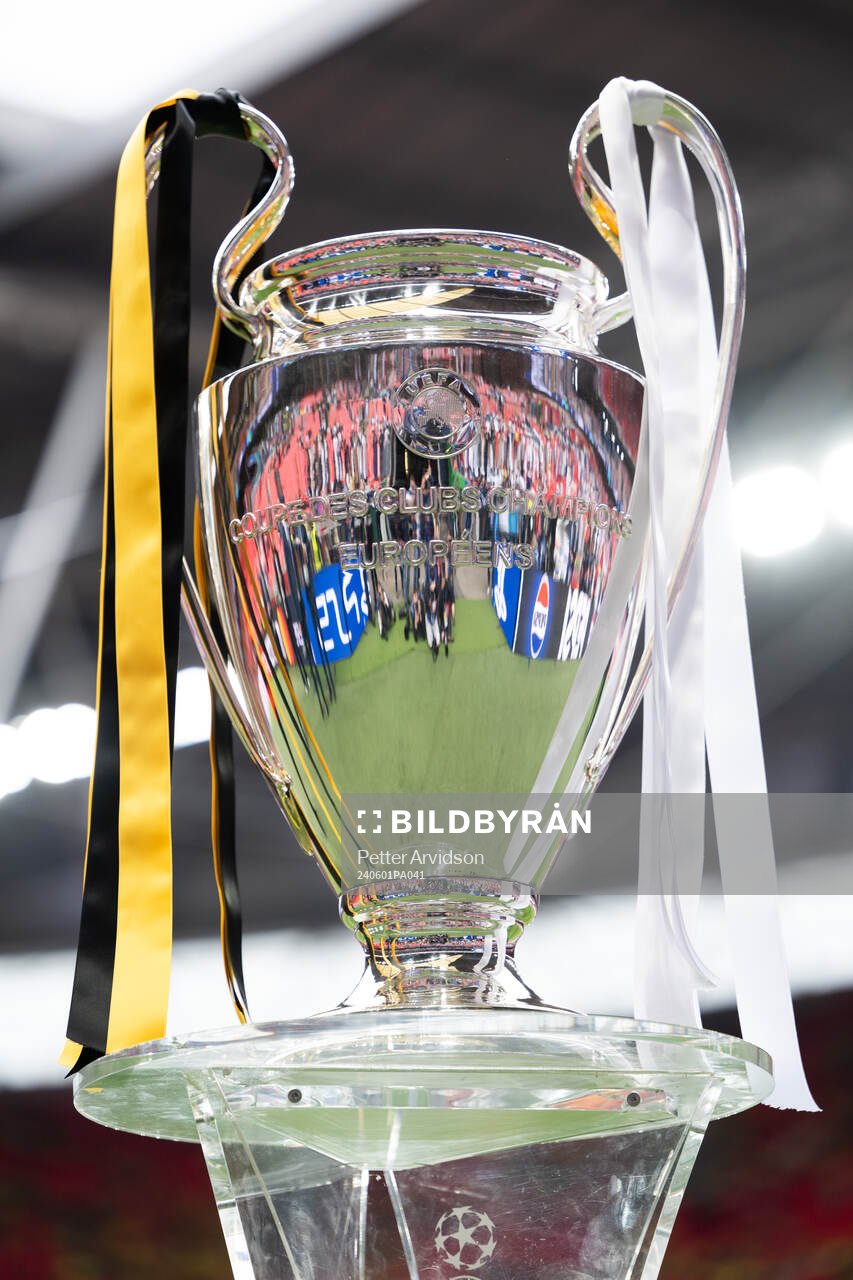 The Champions League trophy is displayed inside the stadium