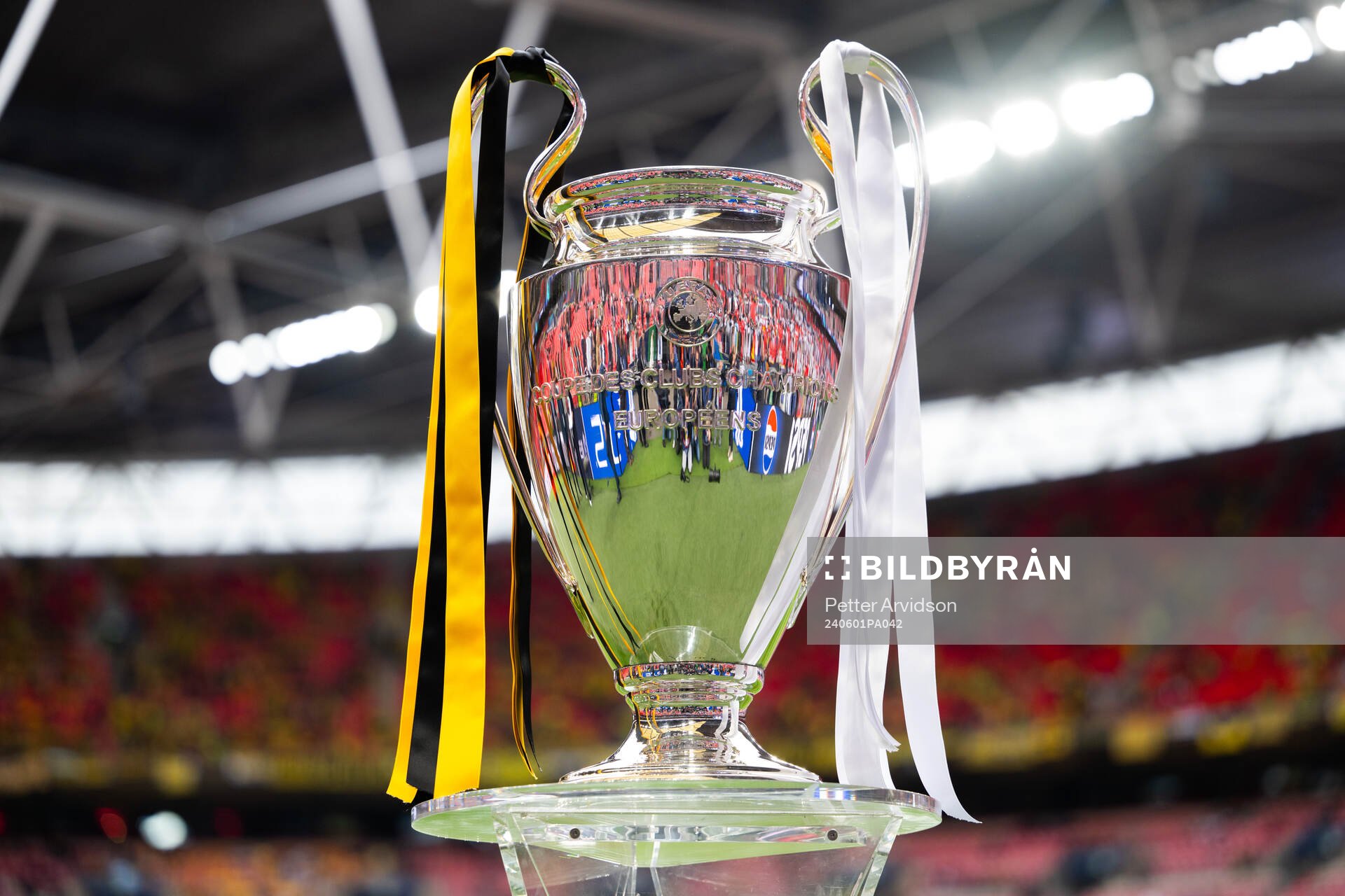 The Champions League trophy is displayed inside the stadium