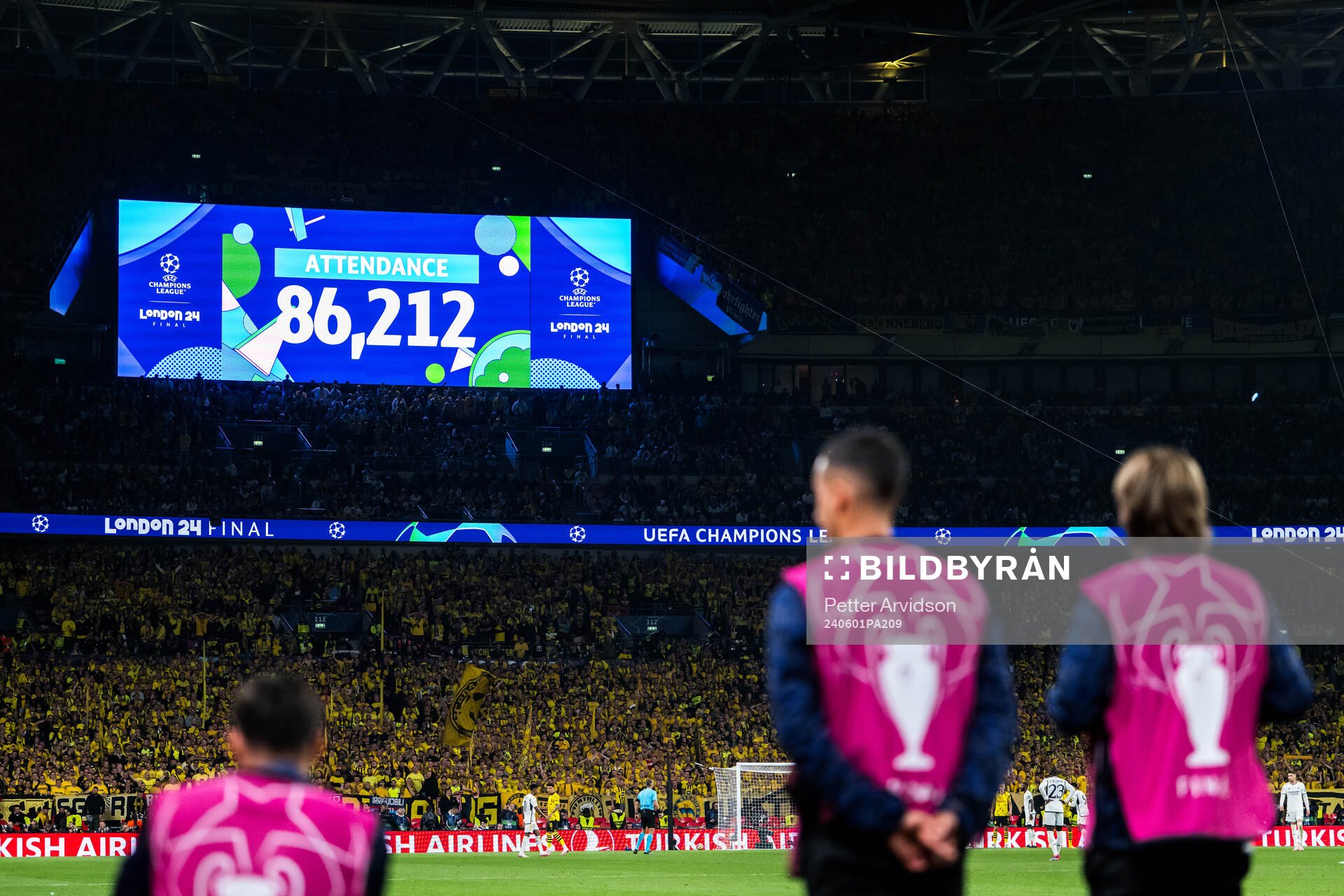 The big screen displays today's match attendance