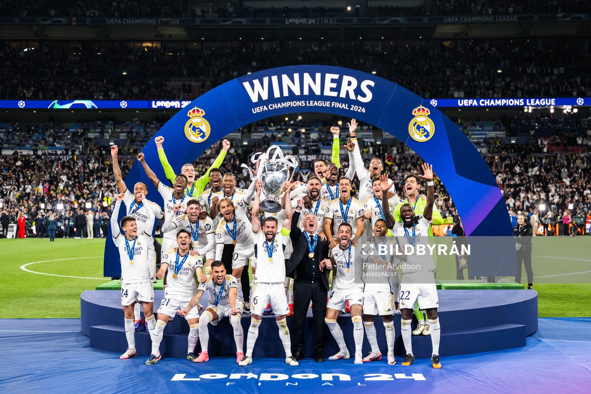Players of Real Madrid celebrate with the trophy