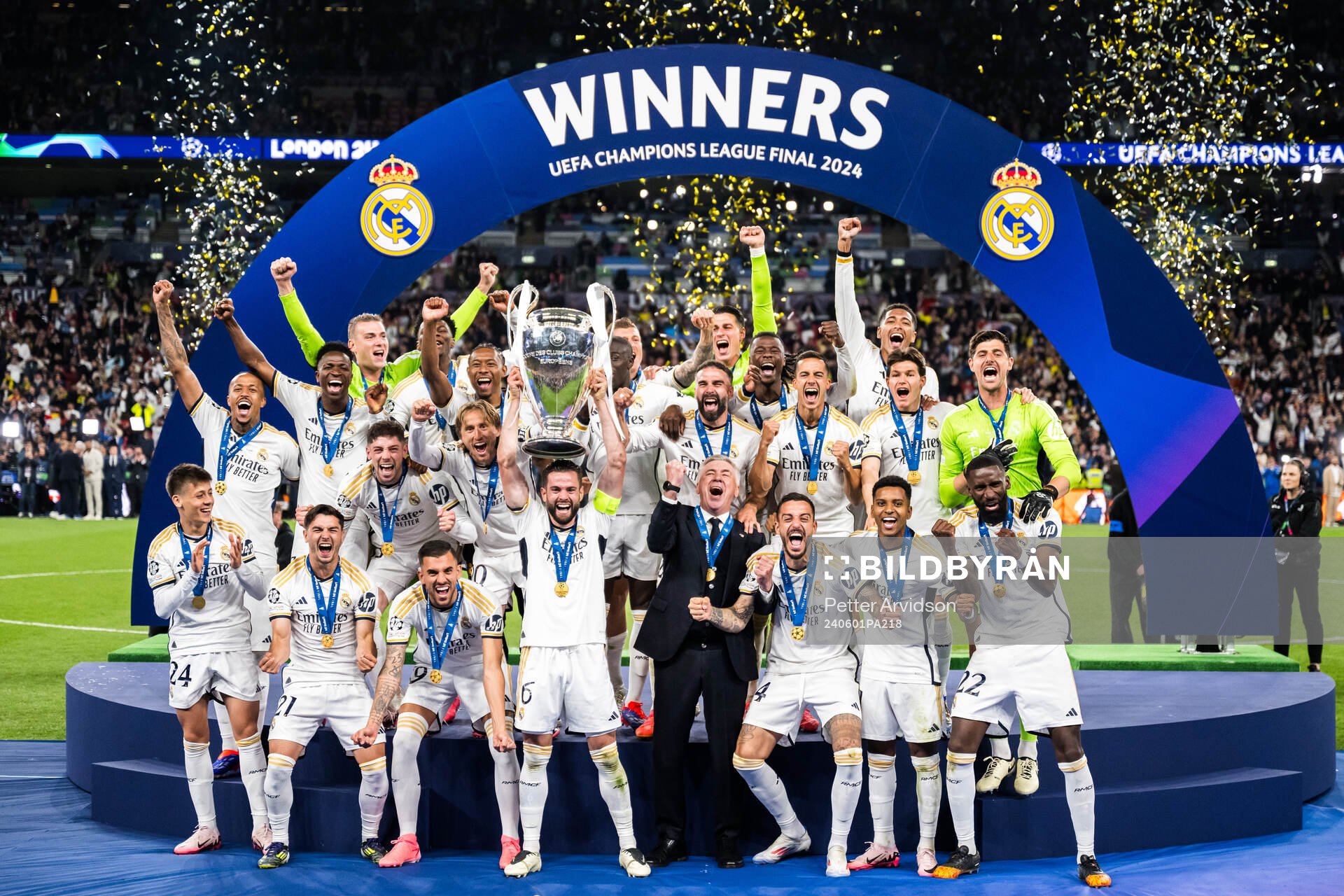 Players of Real Madrid celebrate with the trophy