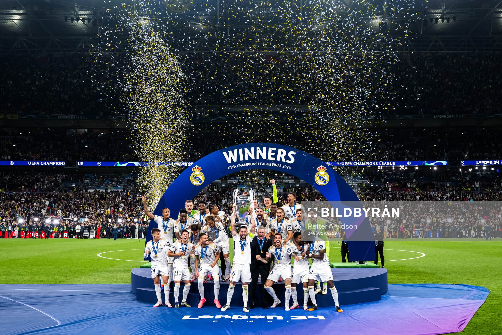 Players of Real Madrid celebrate with the trophy