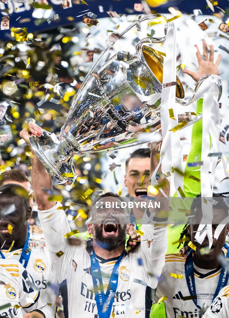 Dani Carvajal of Real Madrid lifts the trophy and celebrate