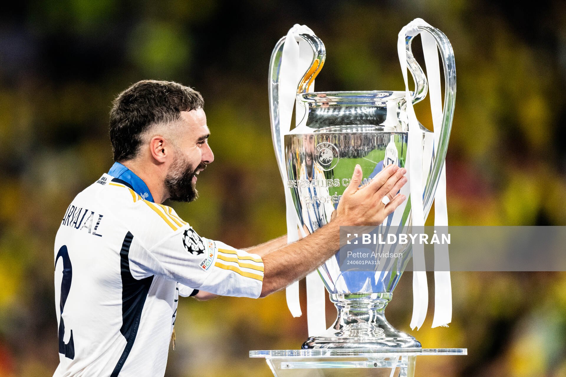 Dani Carvajal of Real Madrid and the trophy