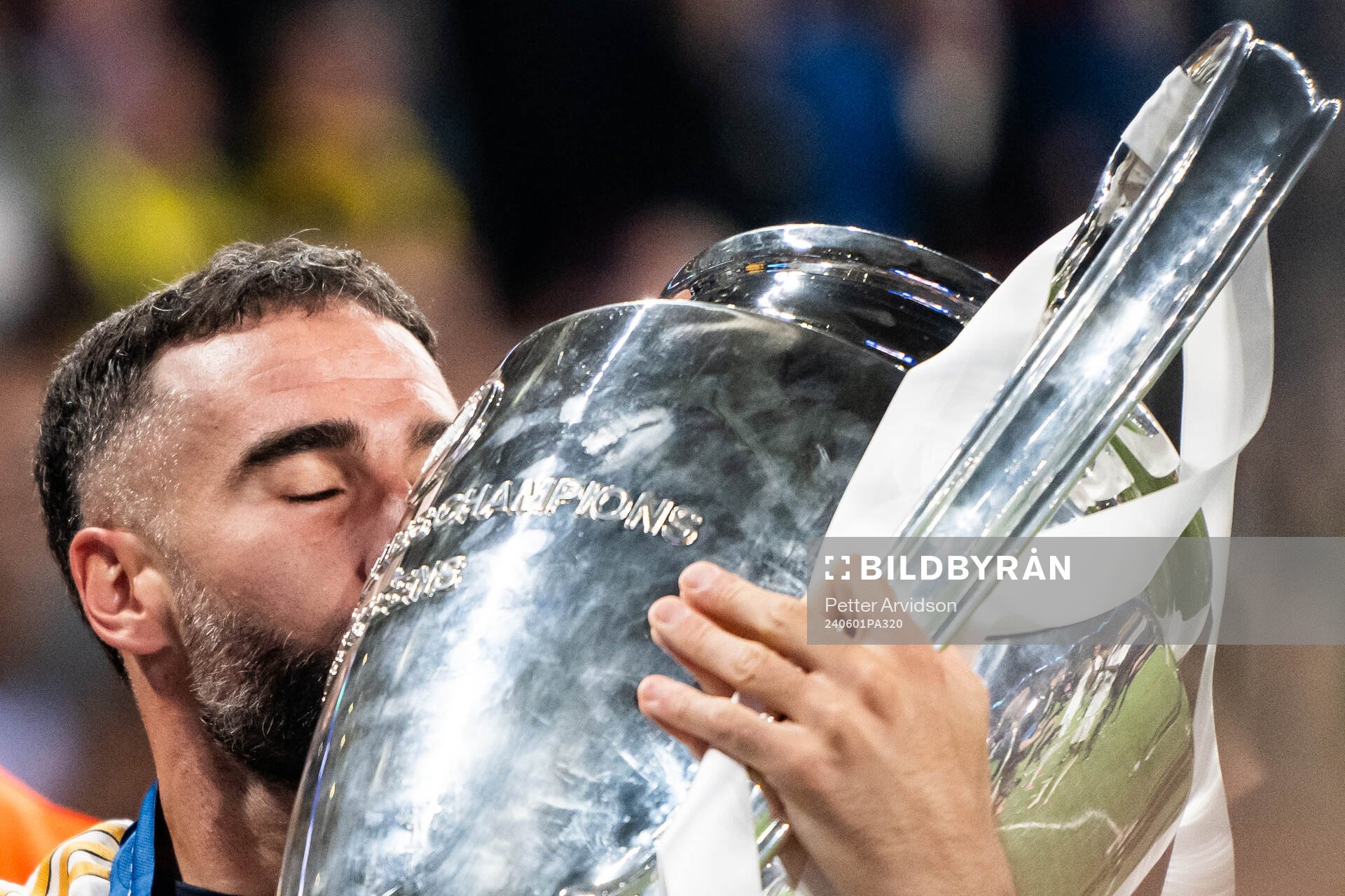 Dani Carvajal of Real Madrid celebrates with the trophy