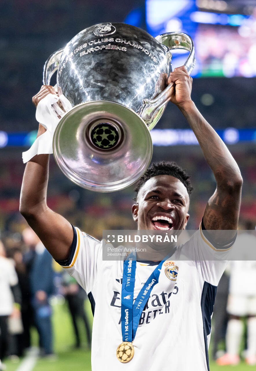 Vinicius Junior of Real Madrid celebrates with the trophy