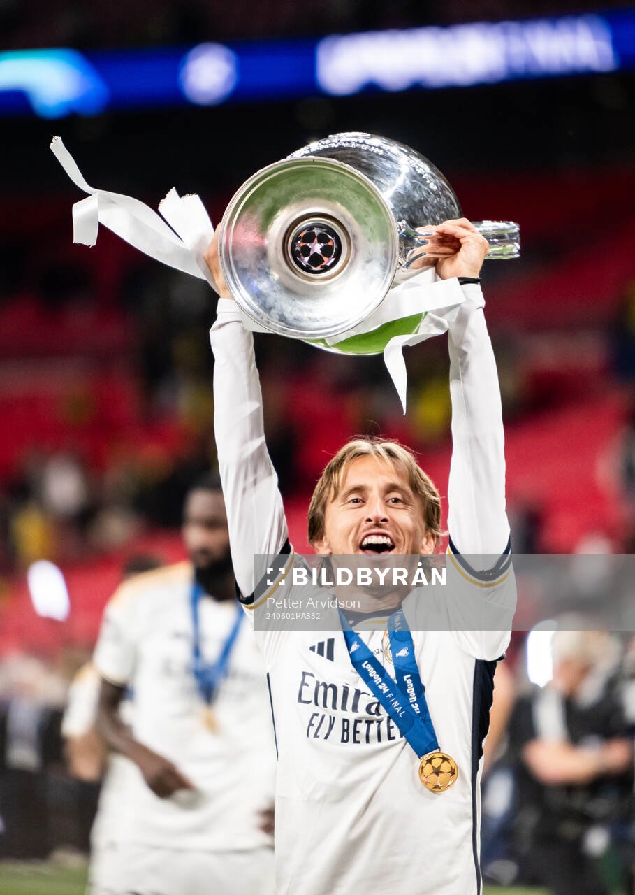Luka Modric of Real Madrid celebrates with the trophy