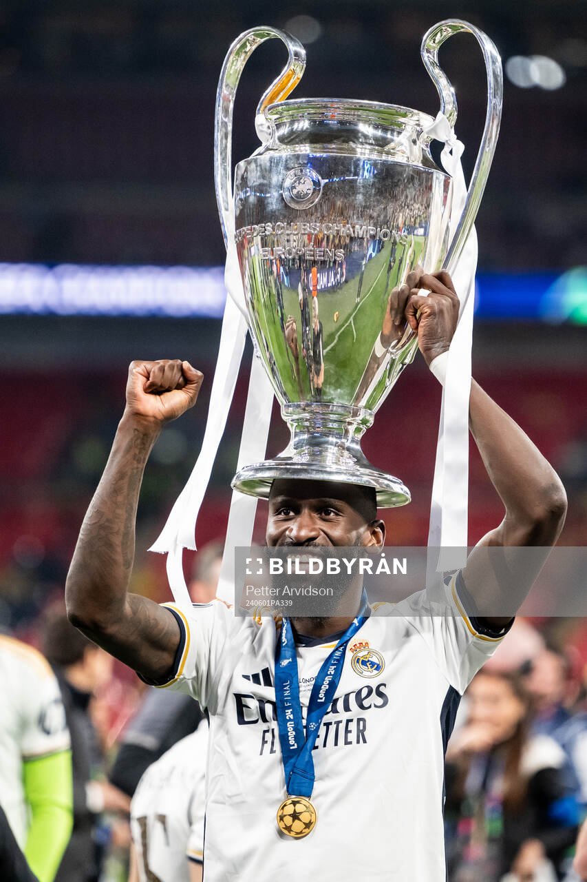Antonio Rudiger of Real Madrid celebrates with the trophy