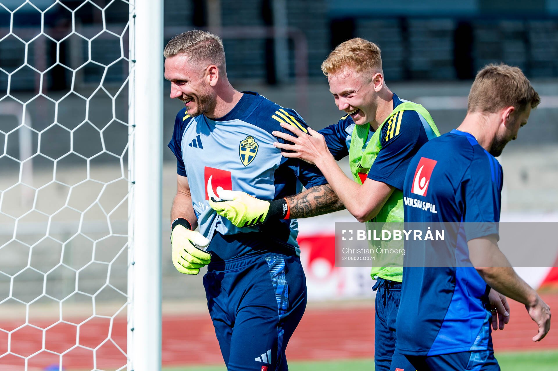 Goalkeeper Robin Olsen and Hugo Larsson of Sweden