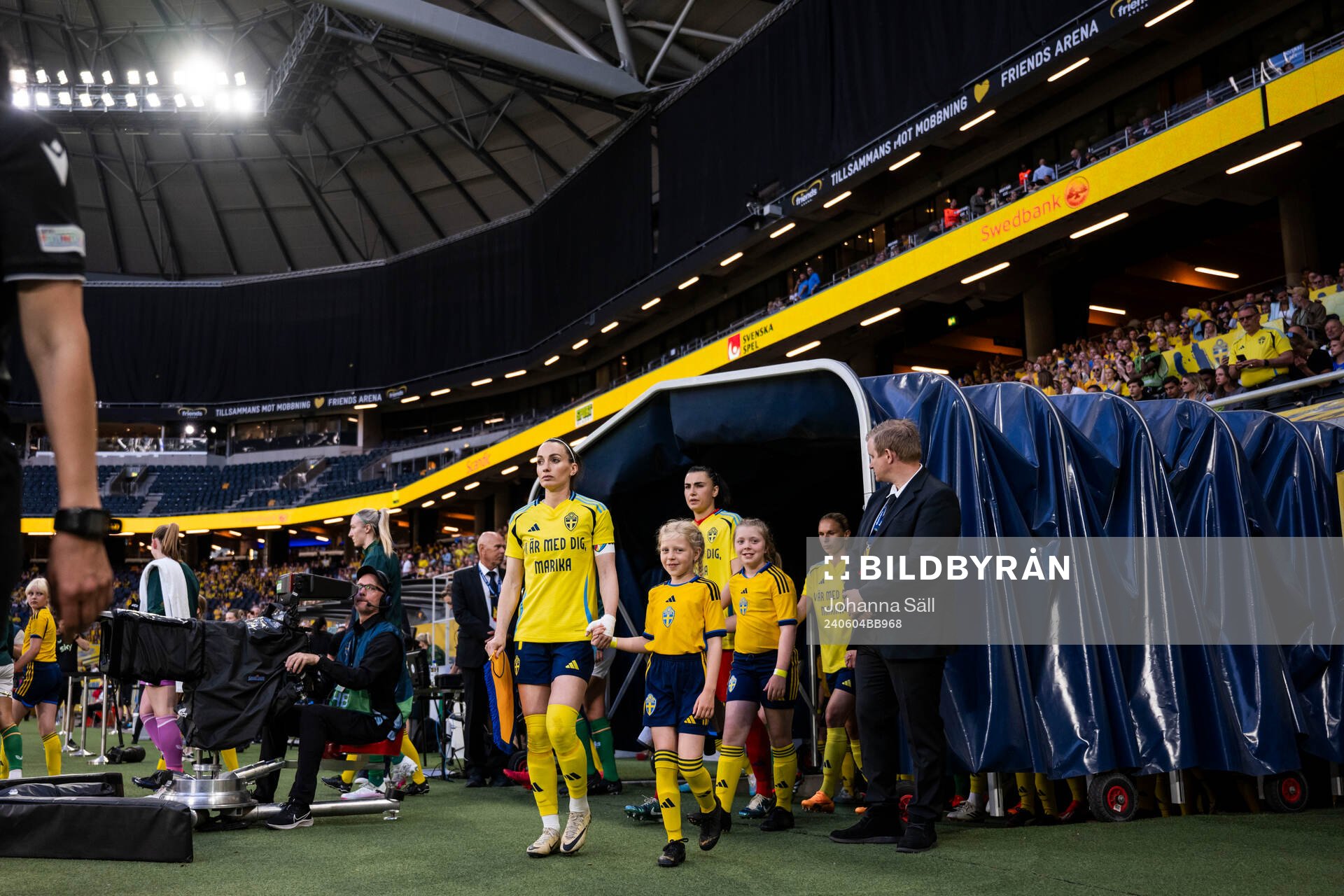 Kosovare Asllani and goalkeeper Zecira Musovic of Sweden