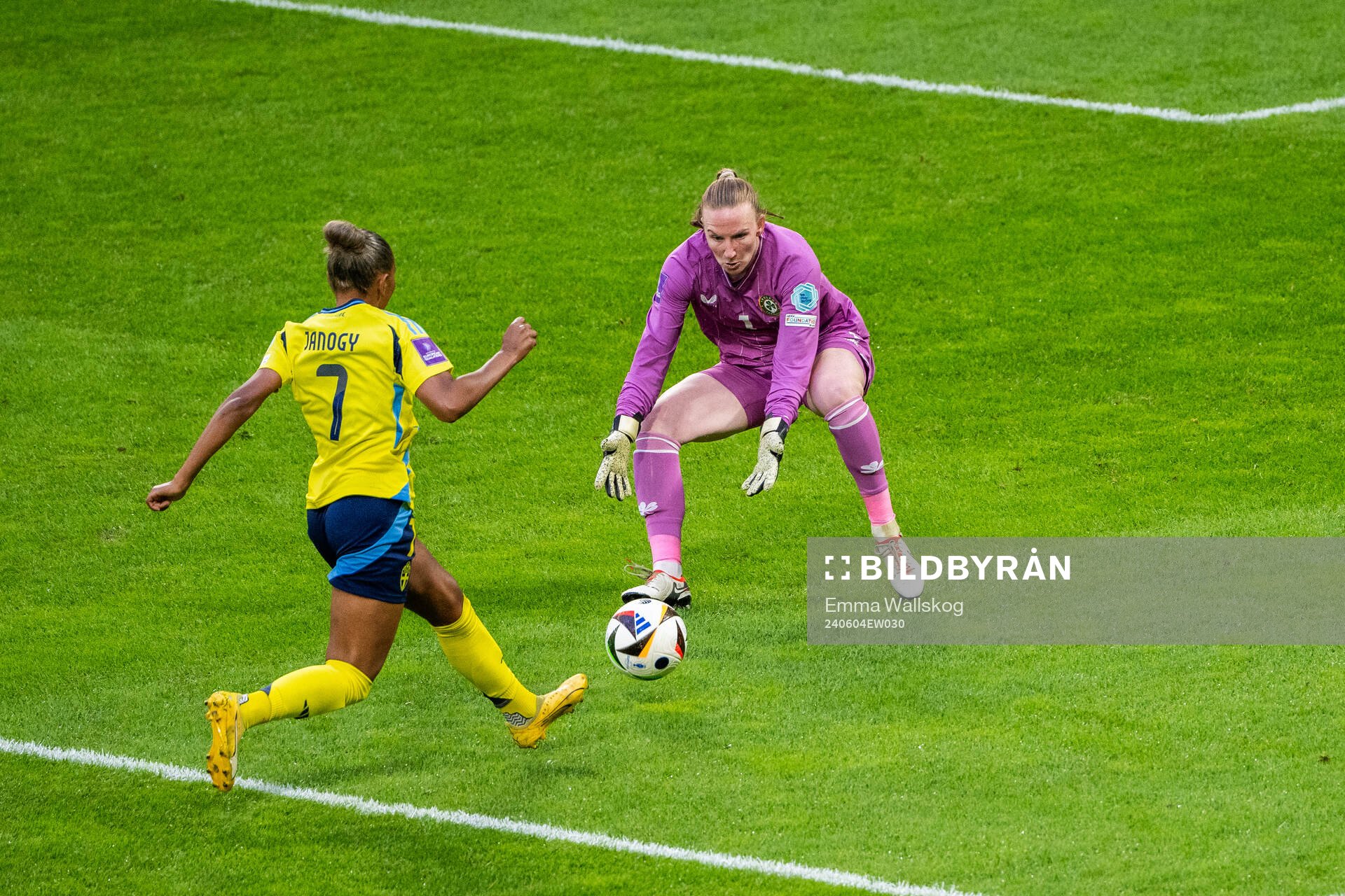 Madelen Janogy of Sweden and goalkeeper Courtney Brosnan of