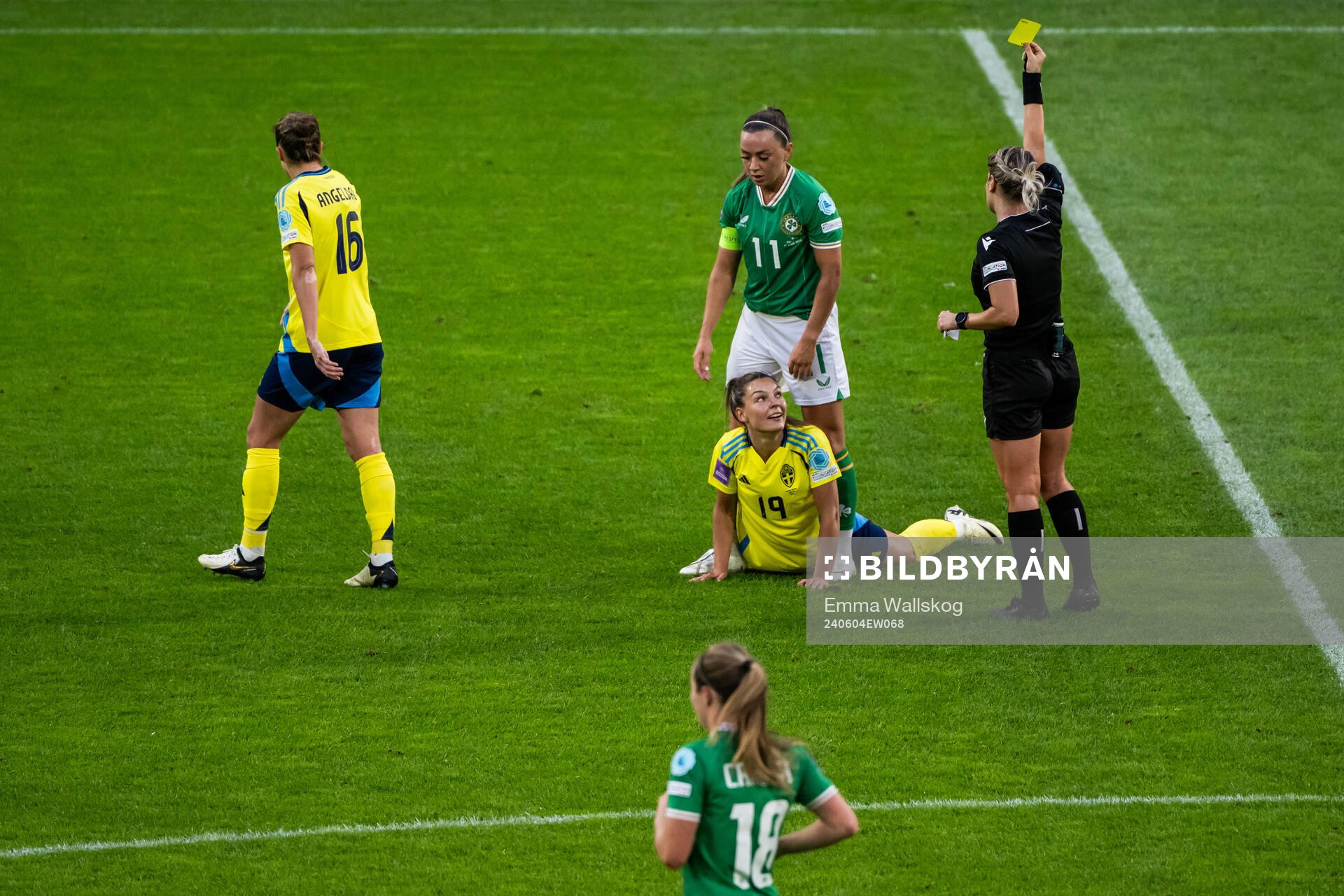 Johanna Rytting Kaneryd of Sweden watch as Katie McCabe of