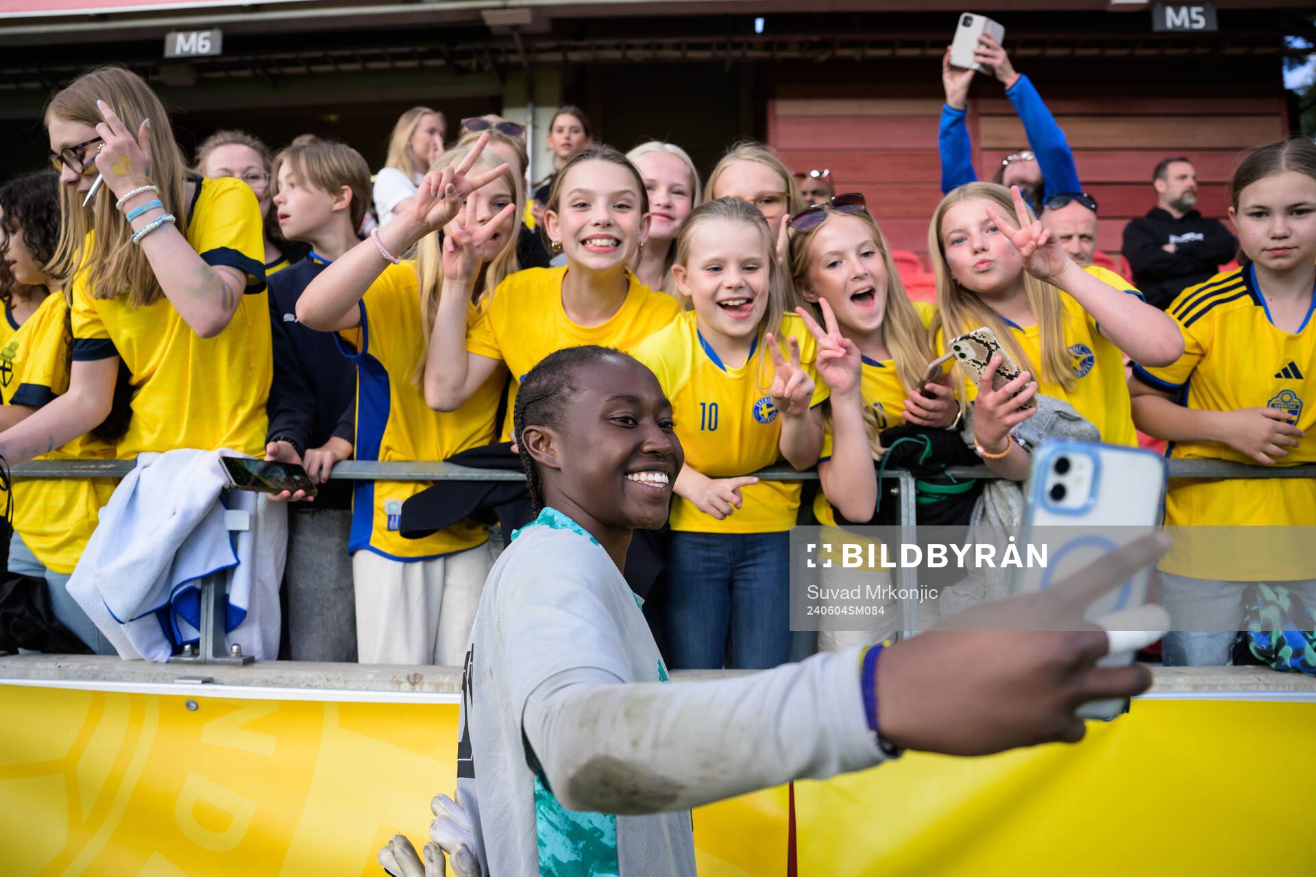 Goalkeeper Angel Mukasa of Sweden is taking selfies with