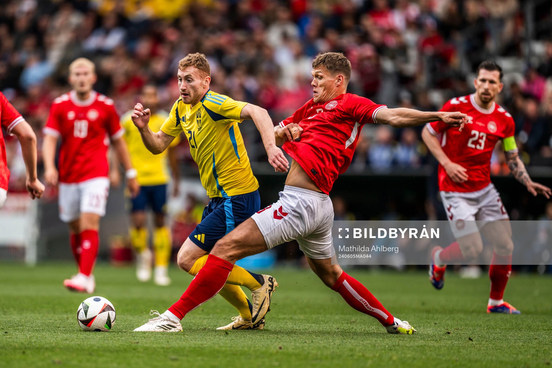 Dejan Kulusevski of Sweden and Jannik Vestergaard of Denmark