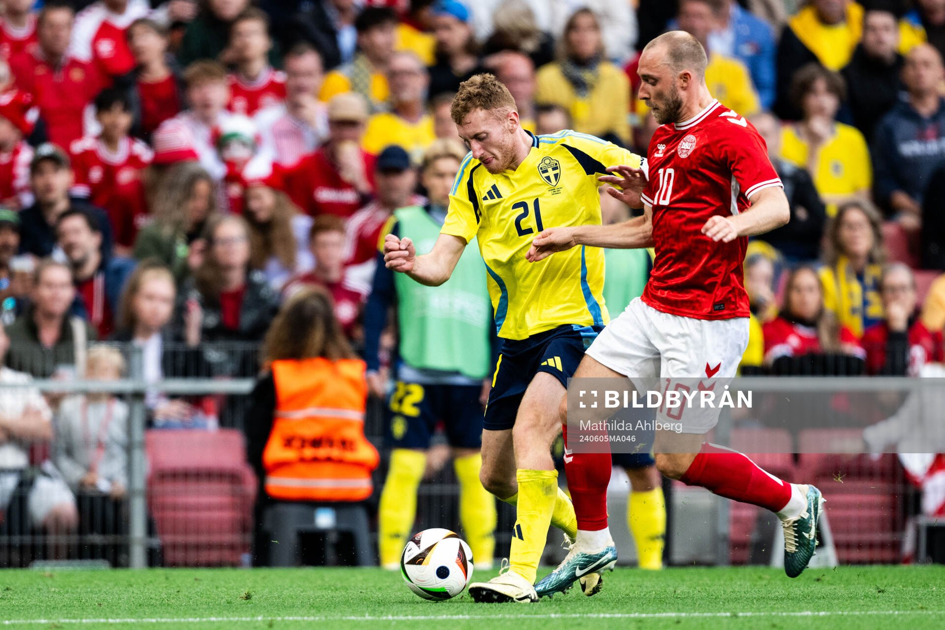 Dejan Kulusevski of Sweden and Christian Eriksen of Denmark