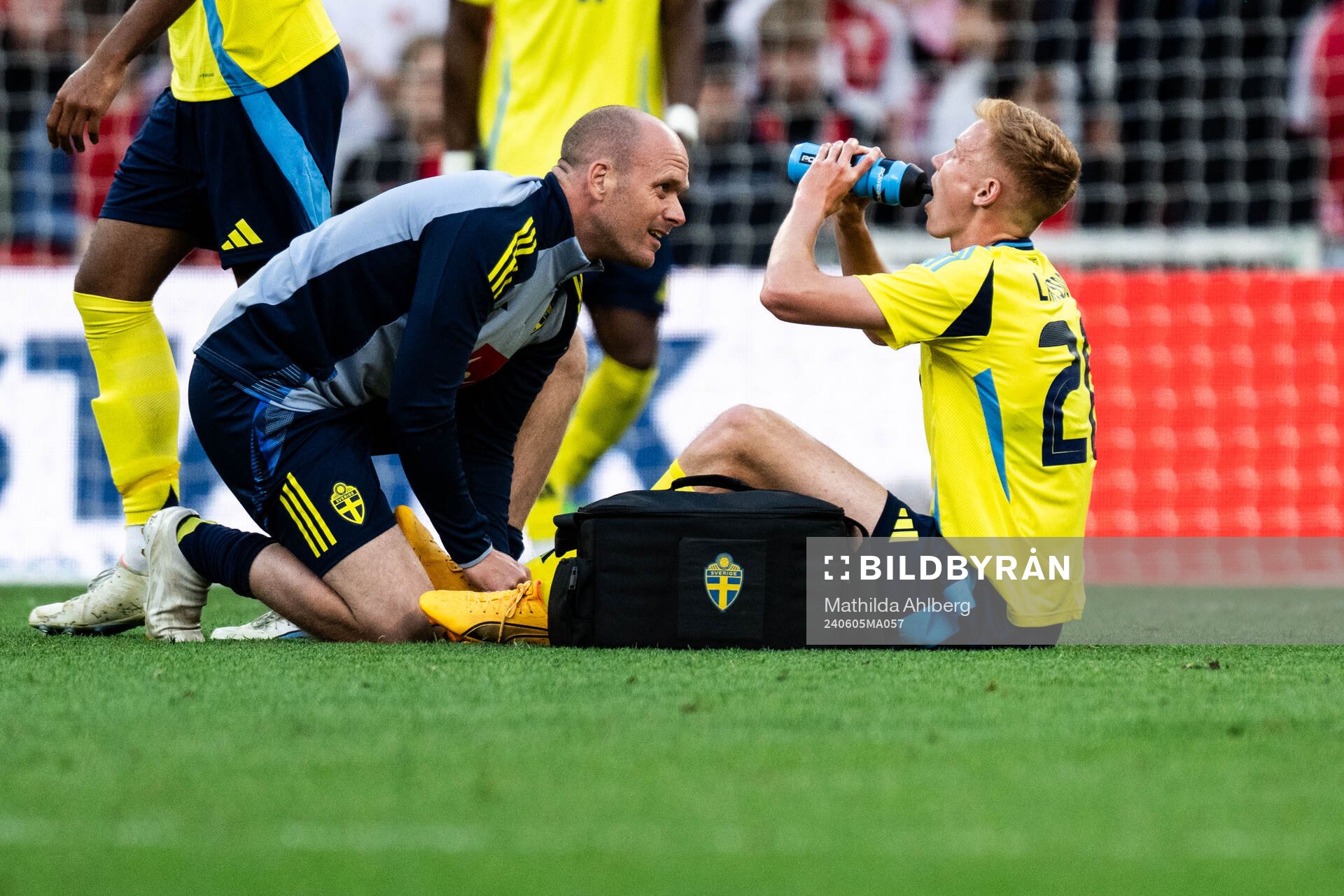 Hugo Larsson of Sweden receives medical attention