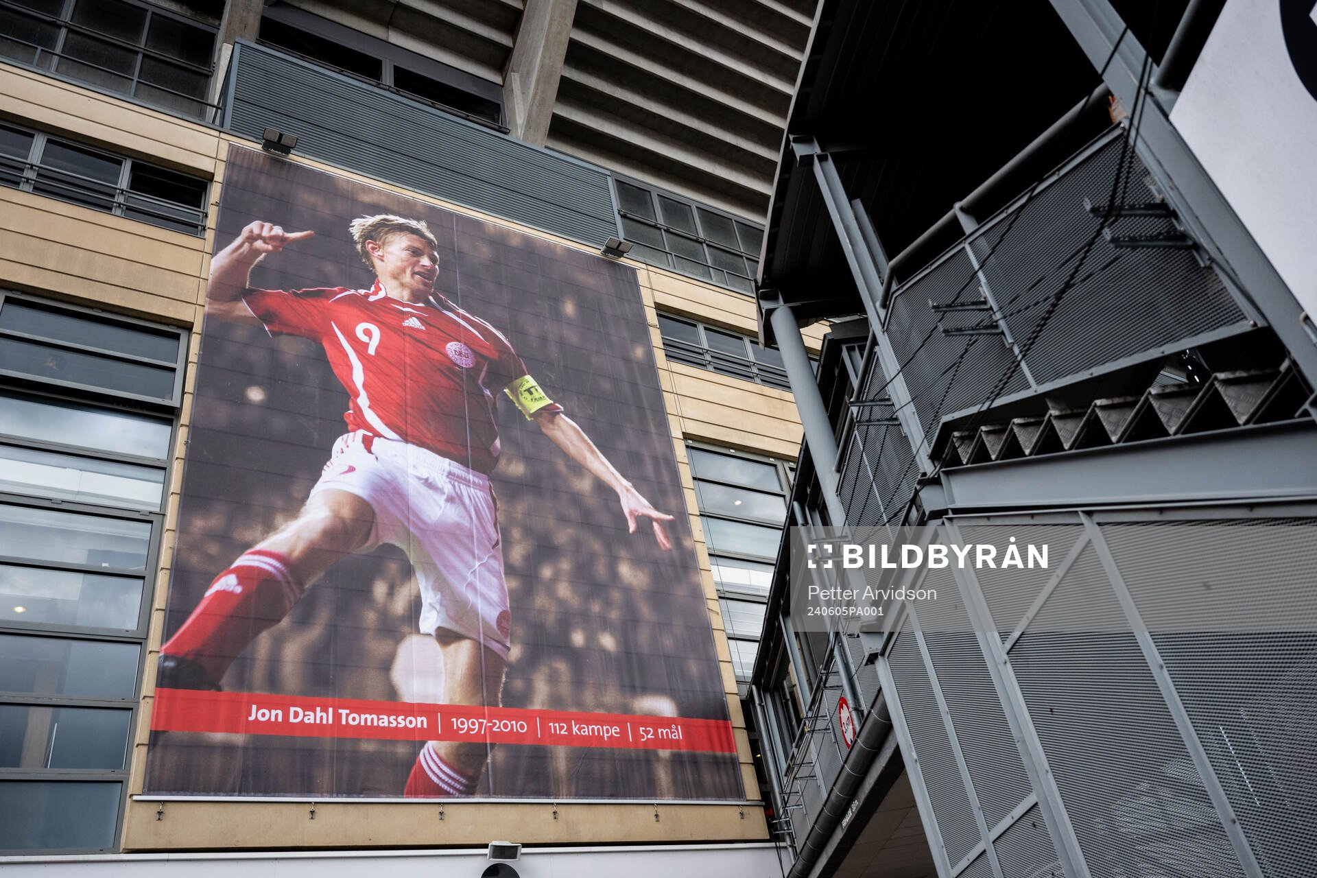 A poster of Jon Dahl Tomasson outside of Parken